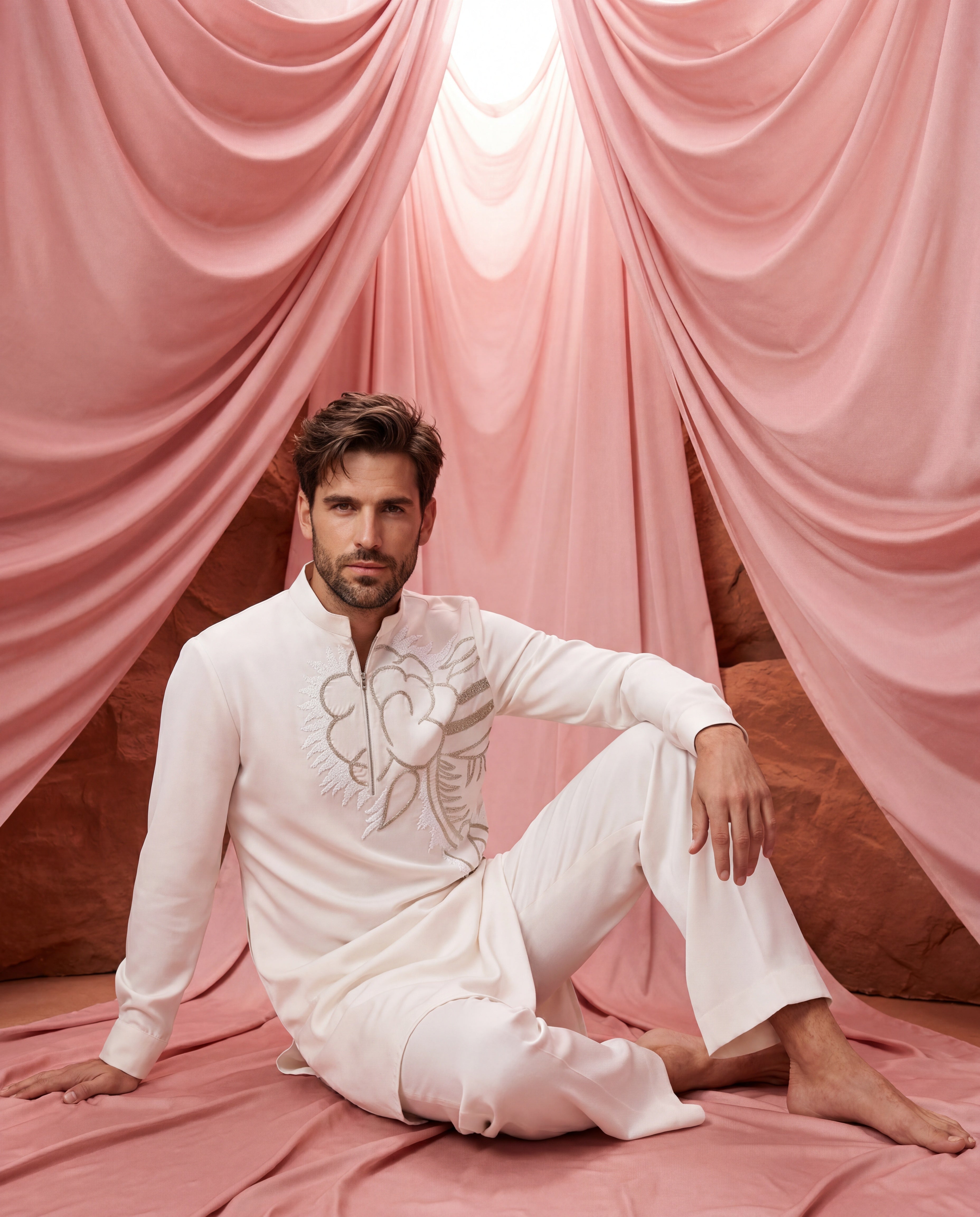 Cream knit kurta with floral embroidered detailing, paired with matching knit palazzo.