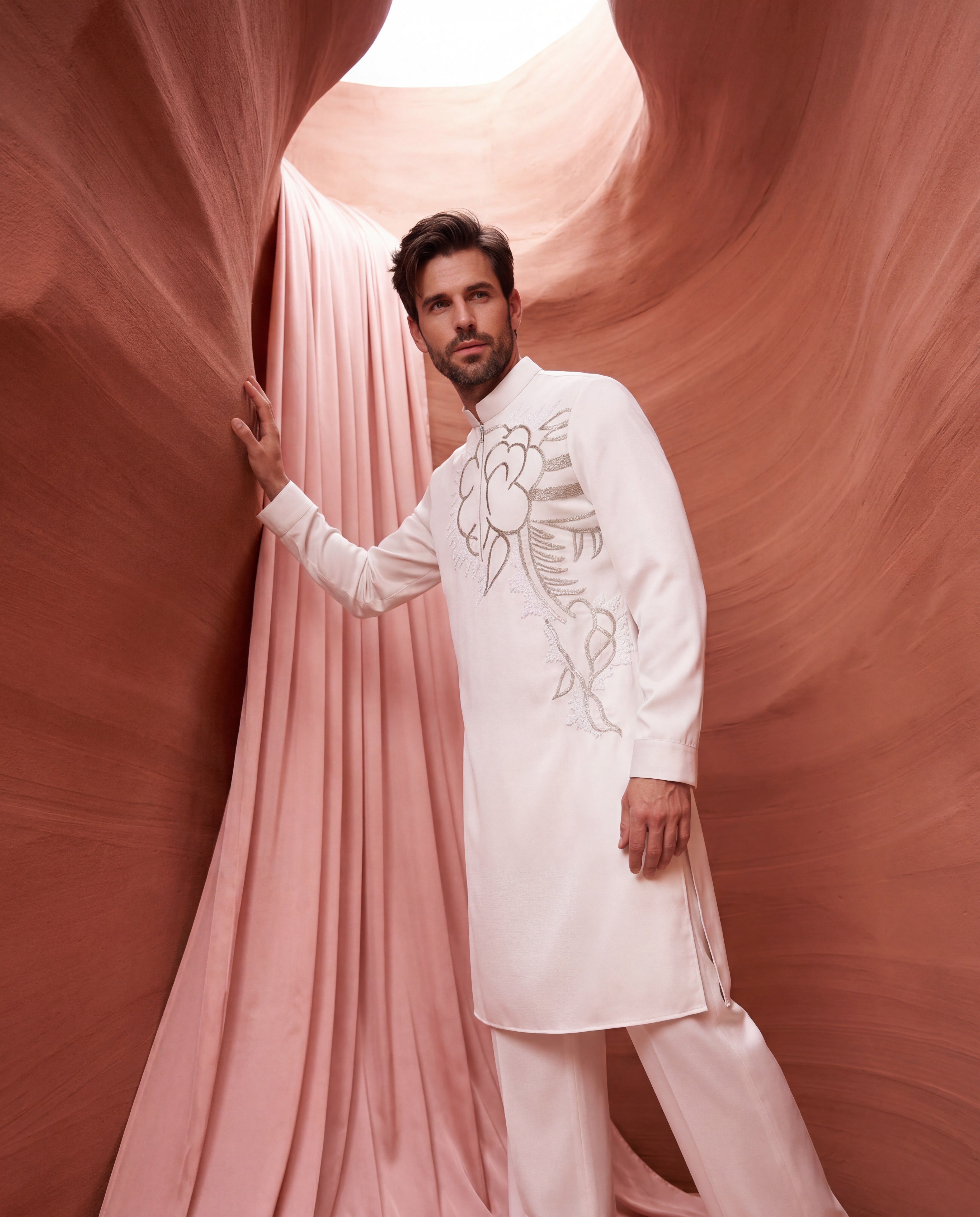 Cream knit kurta with floral embroidered detailing, paired with matching knit palazzo.