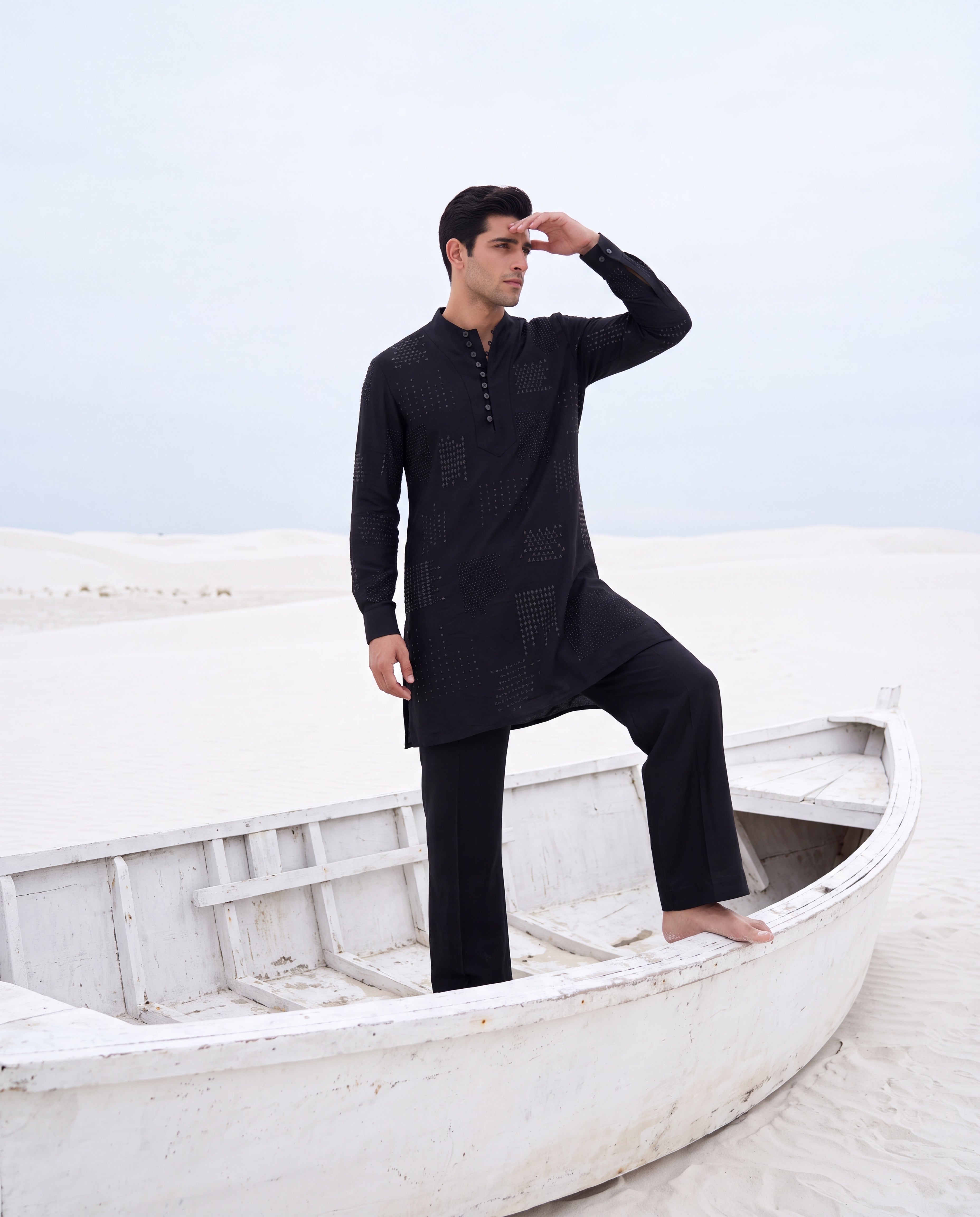 Black knit kurta with tonal embroidered detailing, paired with matching knit palazzo.