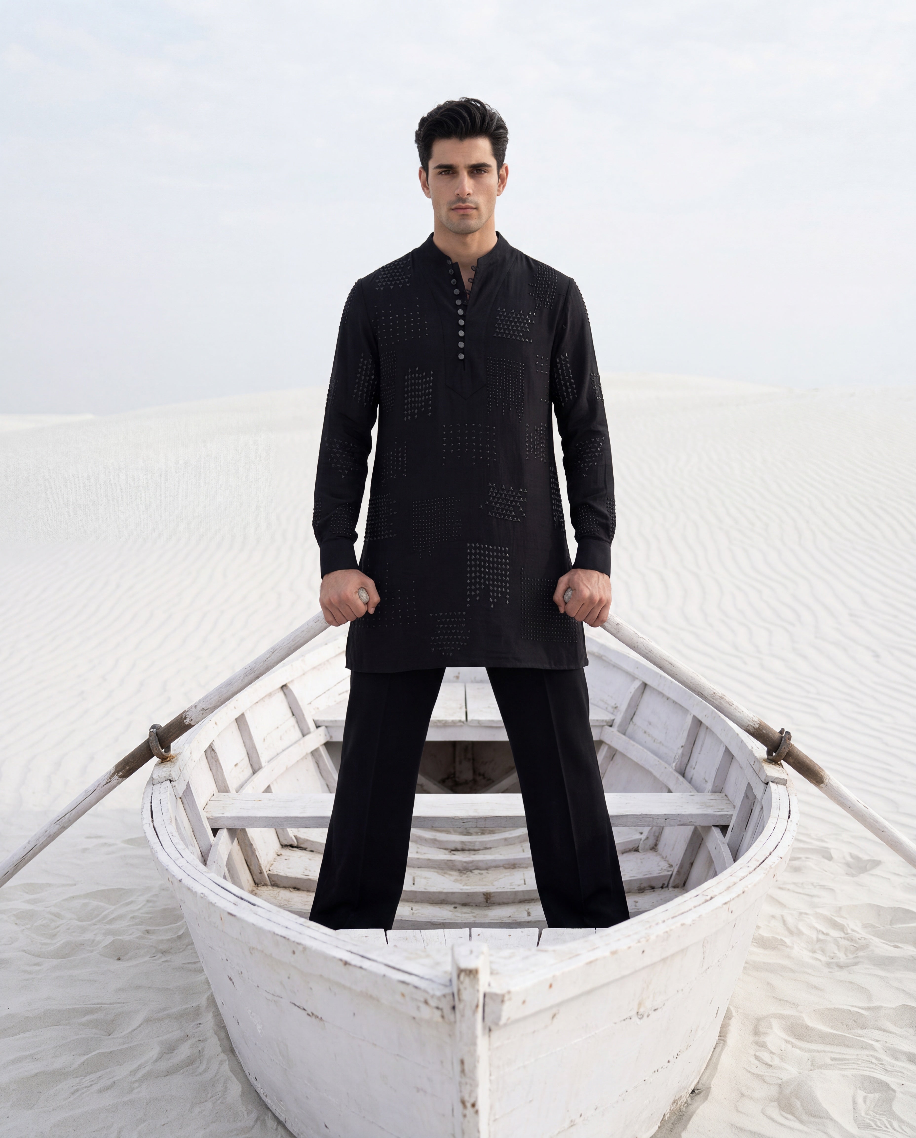 Black knit kurta with tonal embroidered detailing, paired with matching knit palazzo.