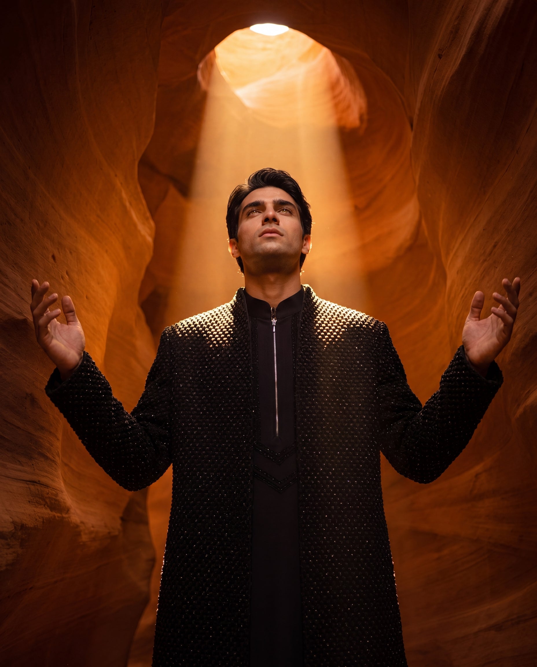 Black Indo-Western jacket with monotoneembroidery, paired with a matching crepe kurta and pants.
