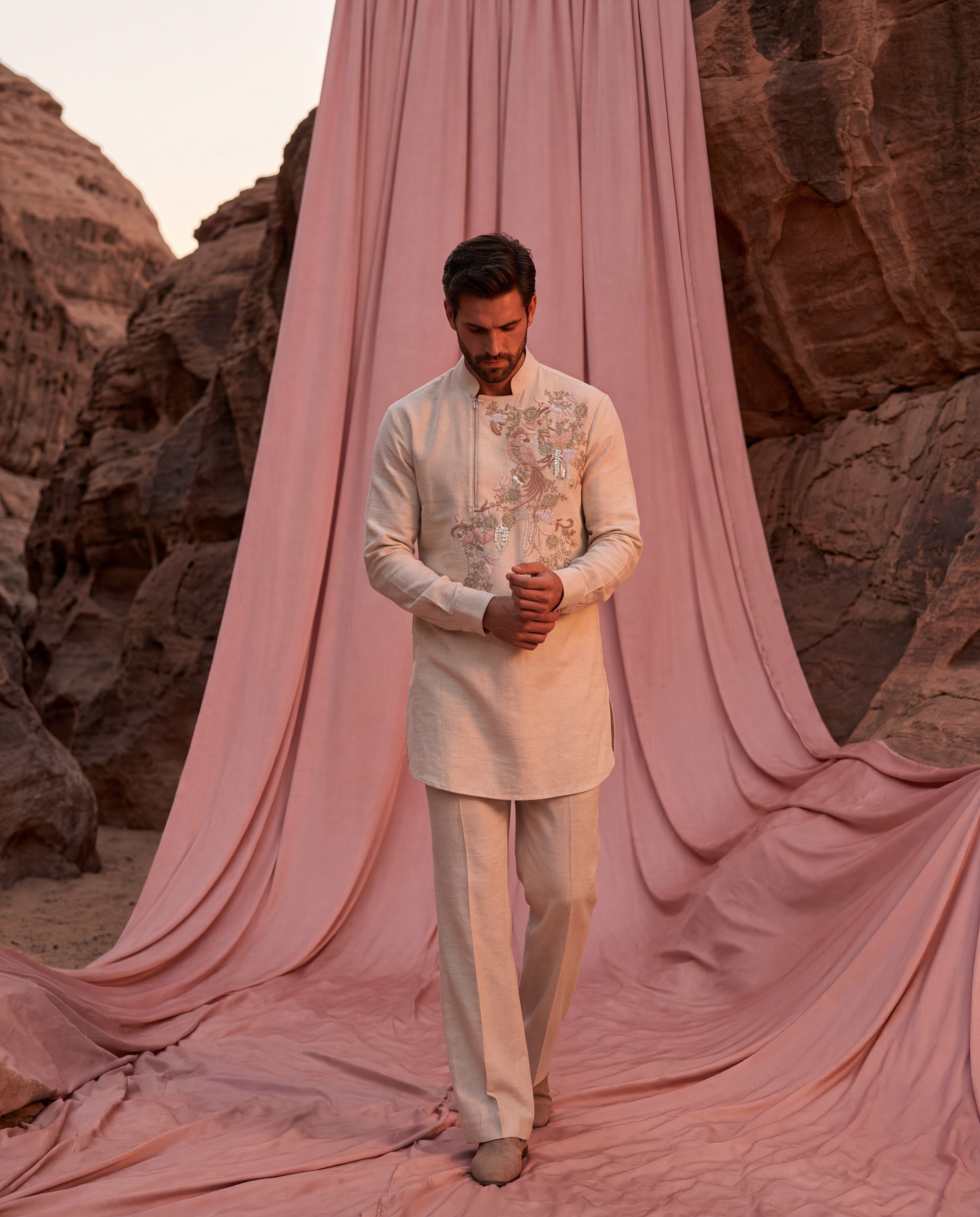 Beige Matka silk kurta with bird embroidery detailing, paired with matching Matka silk palazzo.