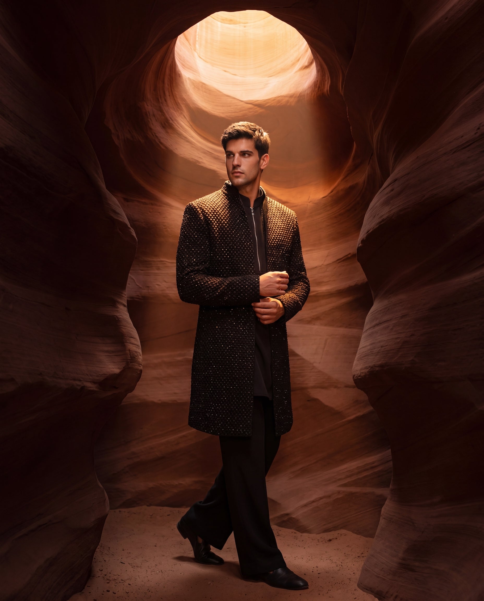 Black Indo-Western jacket with monotoneembroidery, paired with a matching crepe kurta and pants.
