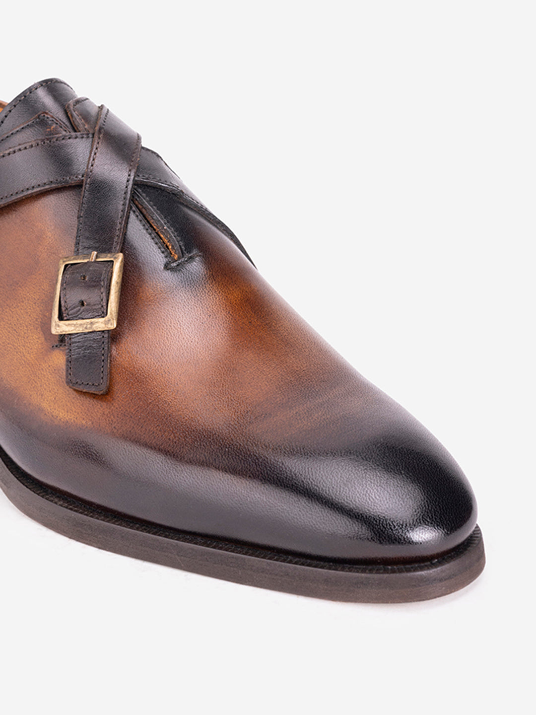 Strapped tan loafers with buckles