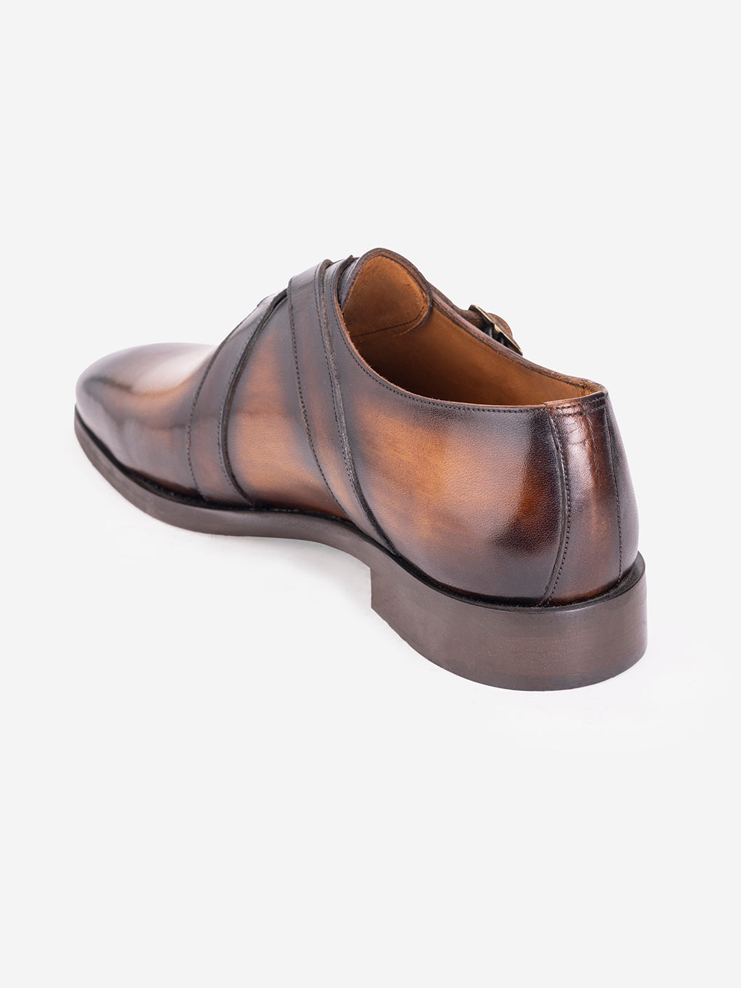 Strapped tan loafers with buckles