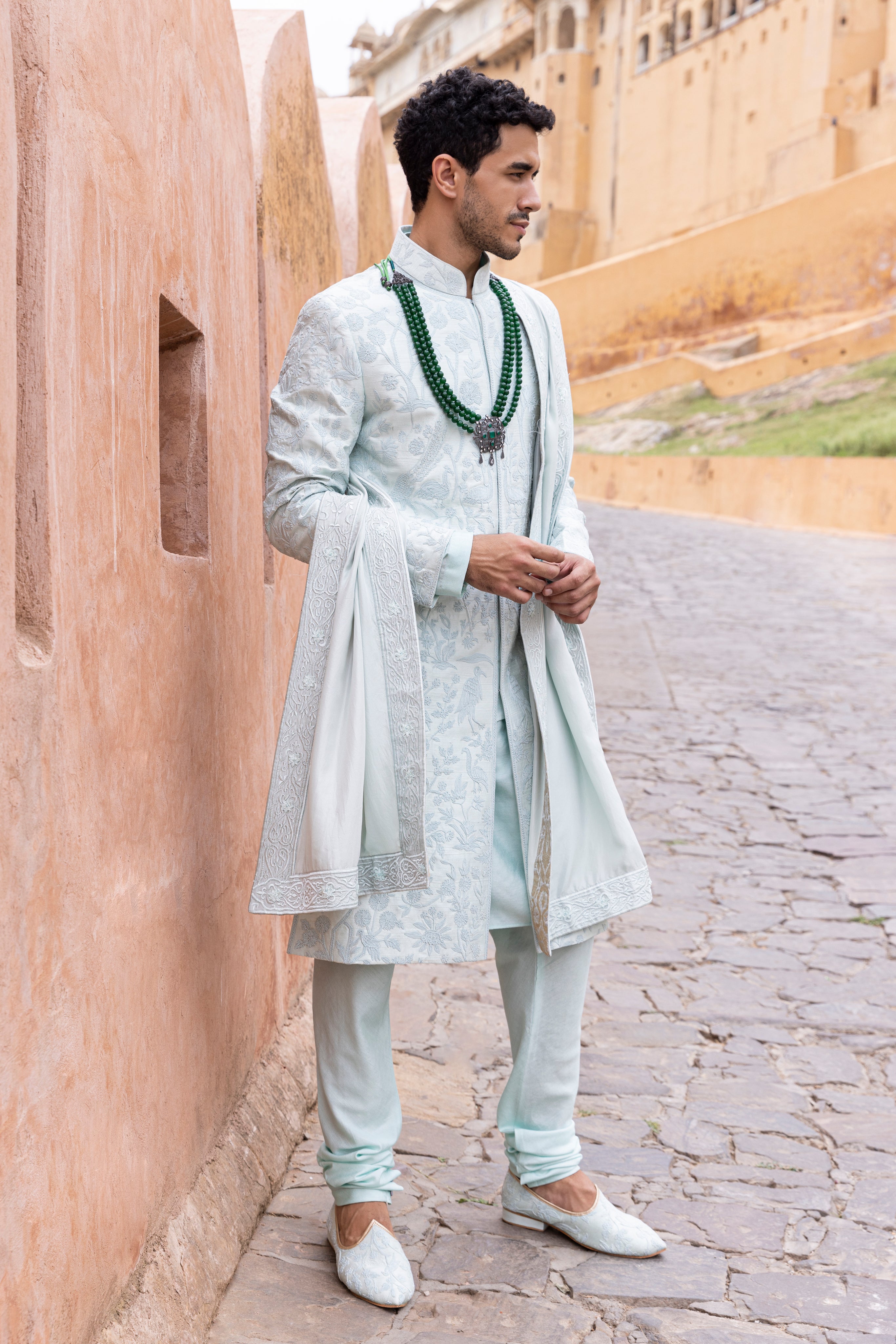 Hand embroidered sherwani paired with matching kurta, pyjama & stole.