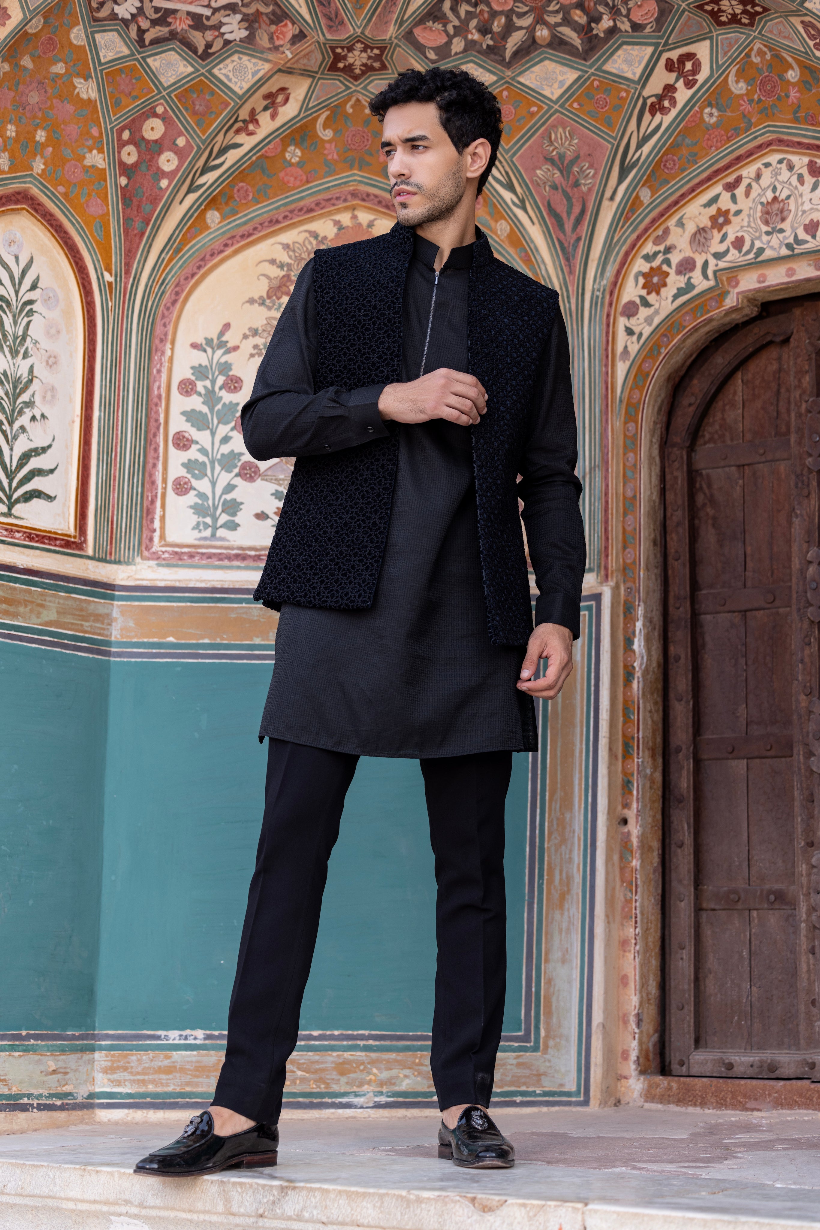 Hand embroidered Frech Knot waistcoat paired with kurta and aligadhi.