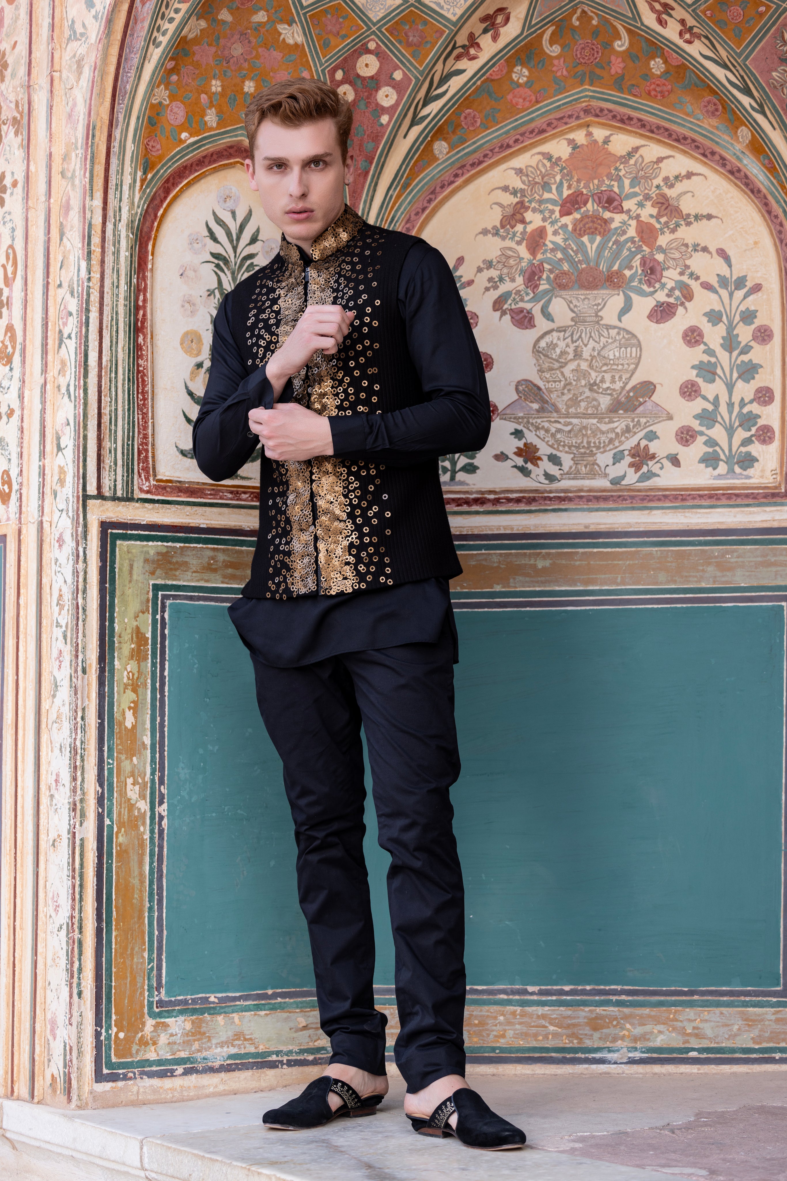 Hand embroidered sequins waistciat paired with kurta and aligadhi.