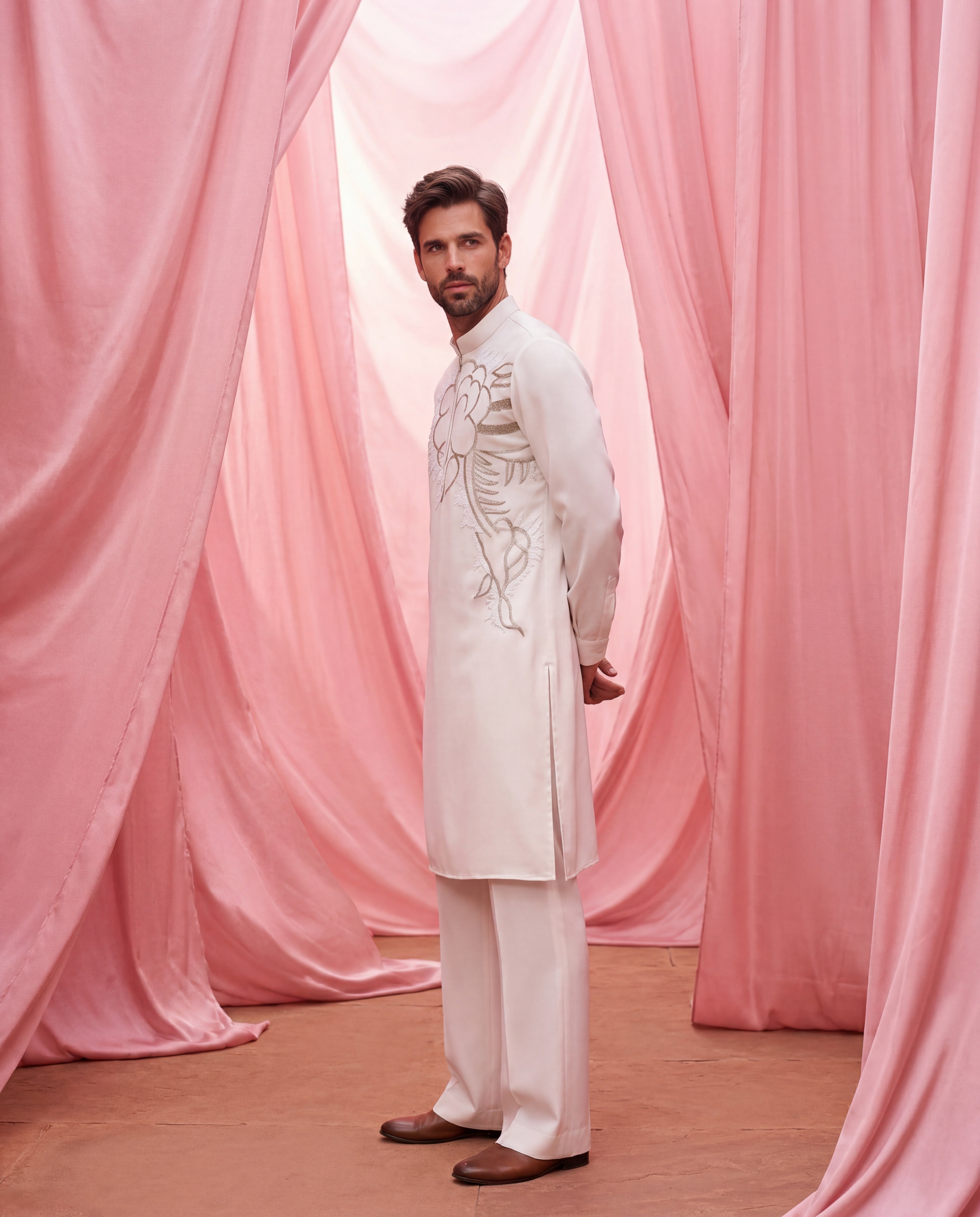 Cream knit kurta with floral embroidered detailing, paired with matching knit palazzo.