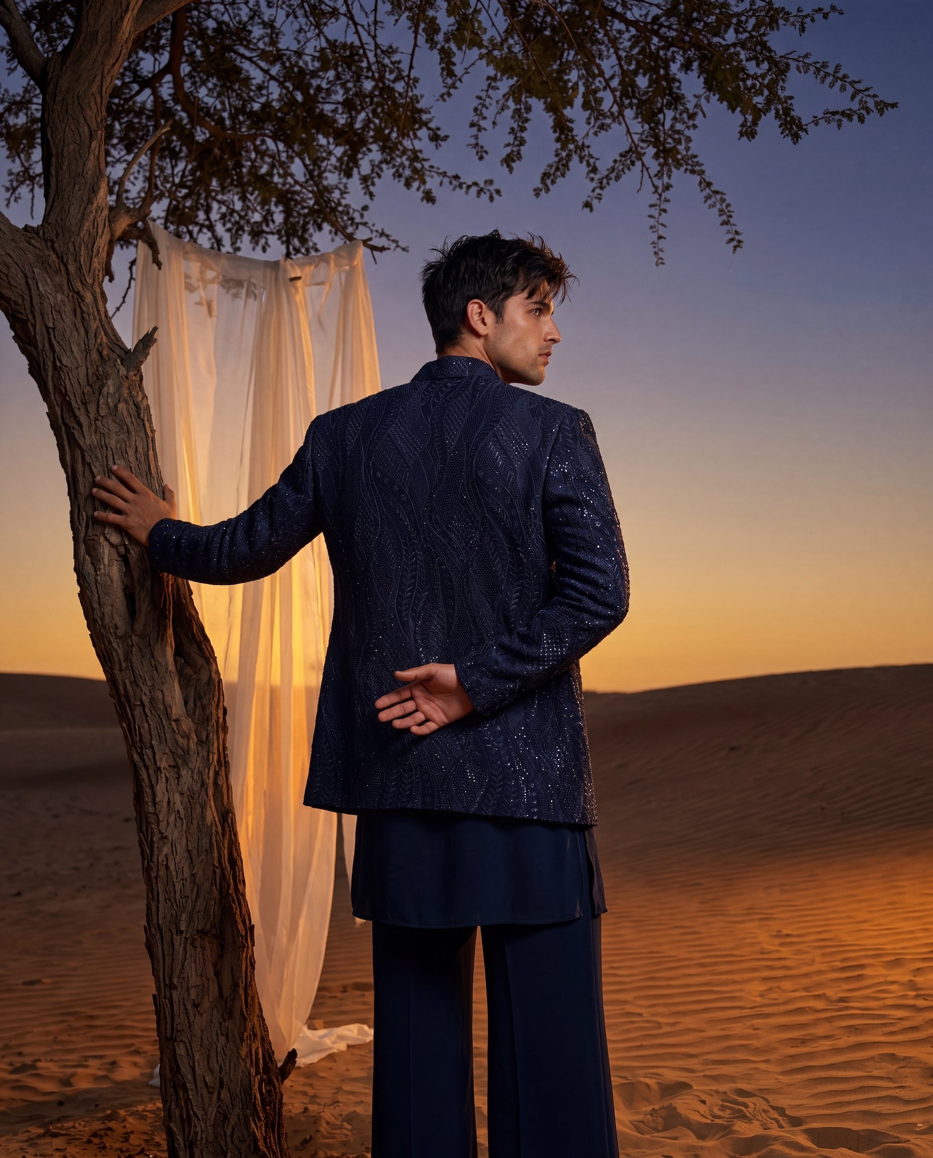 Textured crepe Indo-Western jacket with tonal detailing, paired with a matching crepe kurta and knit pants.