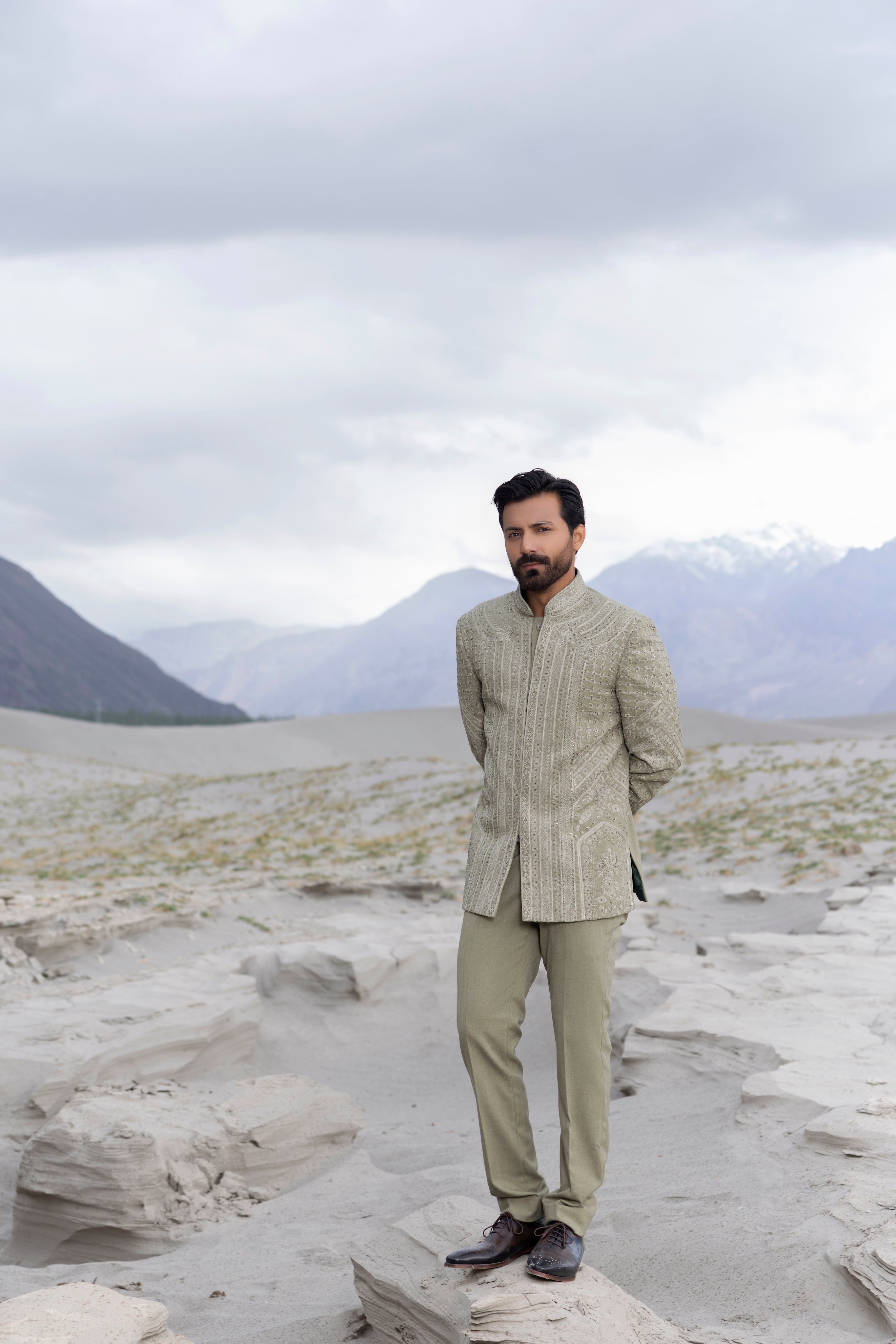 Pista green hand-embroidered short indowestern jacket paired with matching  pants.