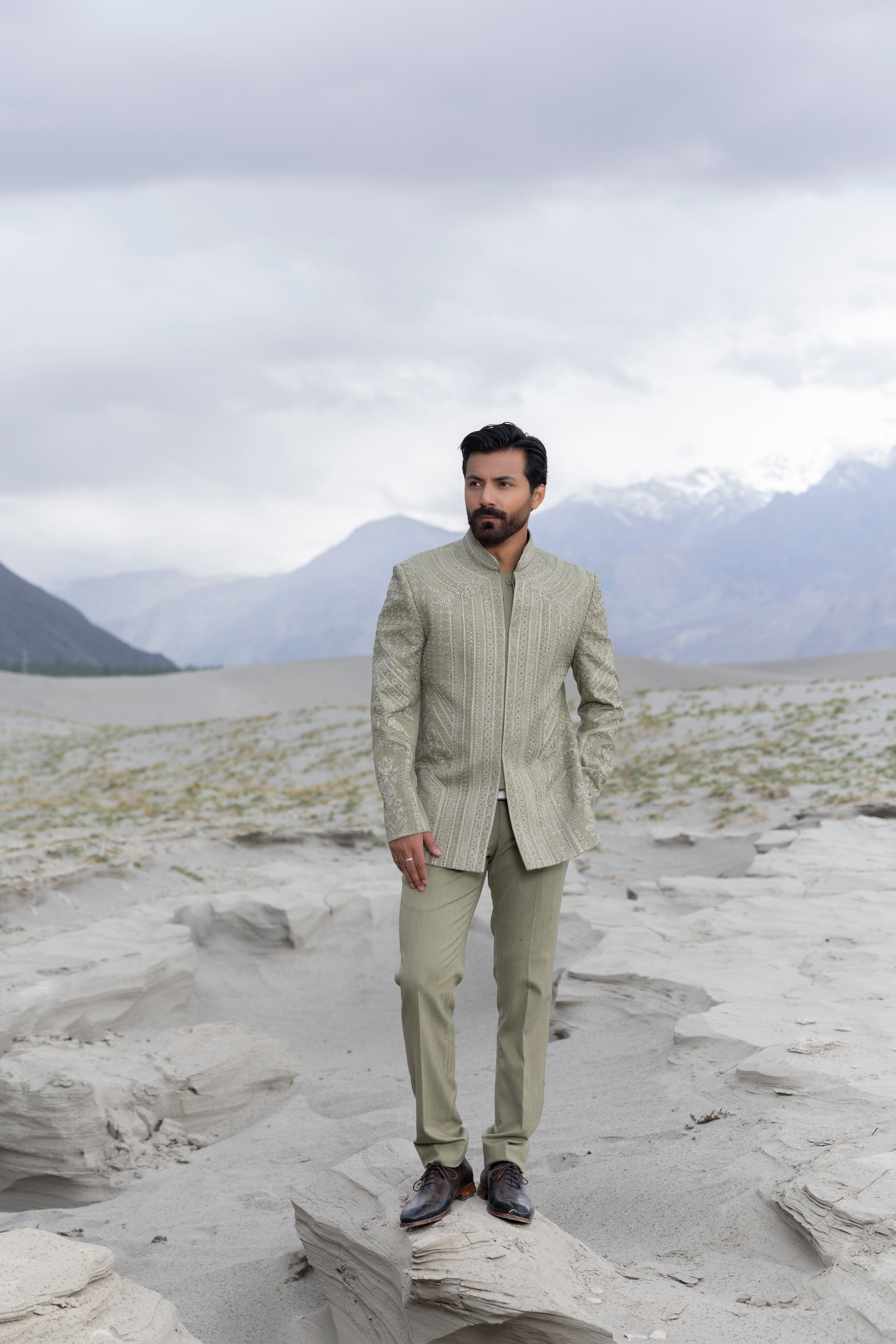 Pista green hand-embroidered short indowestern jacket paired with matching  pants.