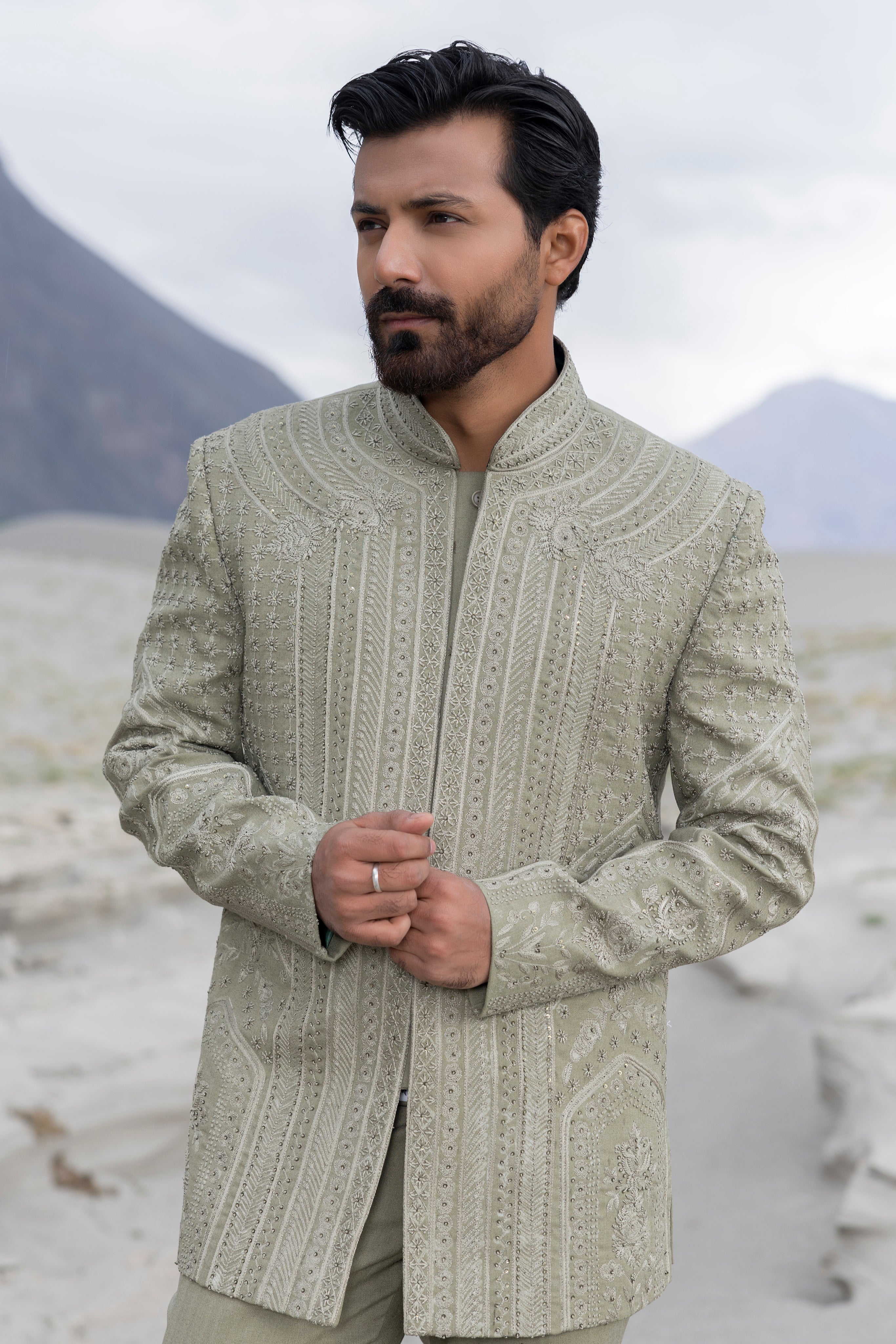 Pista green hand-embroidered short indowestern jacket paired with matching  pants.