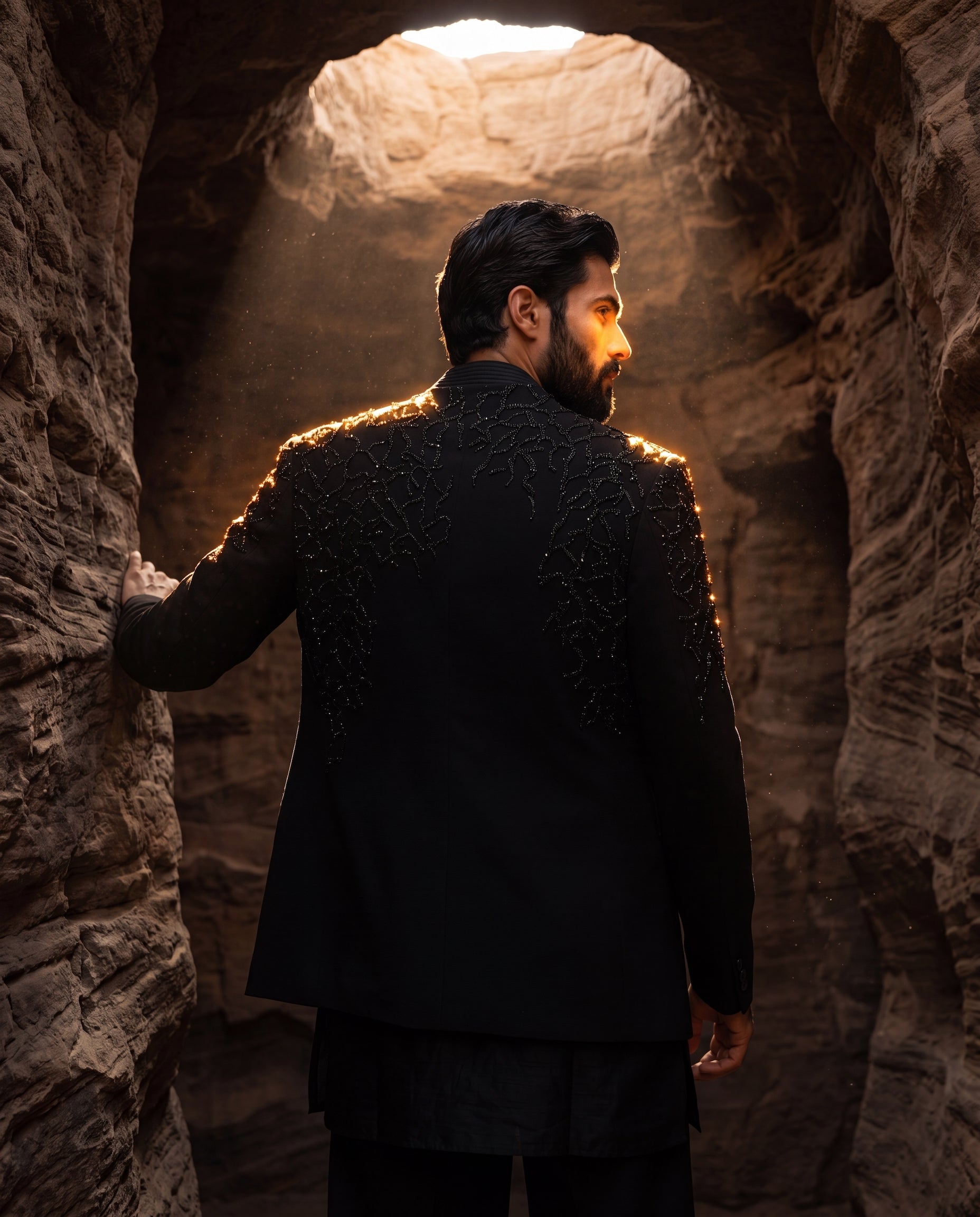 Textured knit Indo-Western jacket with tonal detailing, paired with a raw silk kurta and matching knit pants.