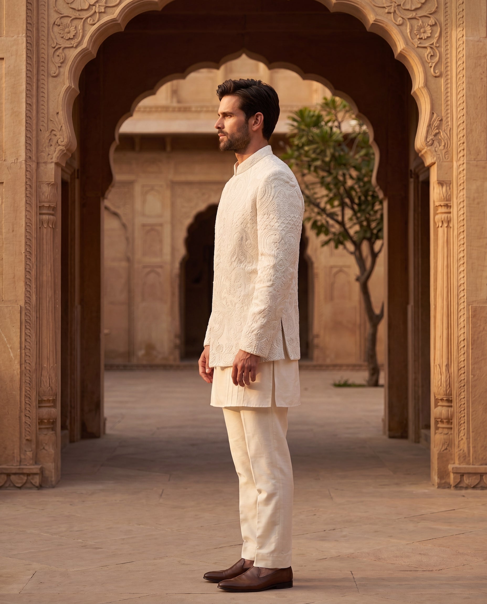 Linen rayon silk Indo-Western jacket with monotone embroidery detailing, paired with a kurta with pintucks detailing and matching palazzo.