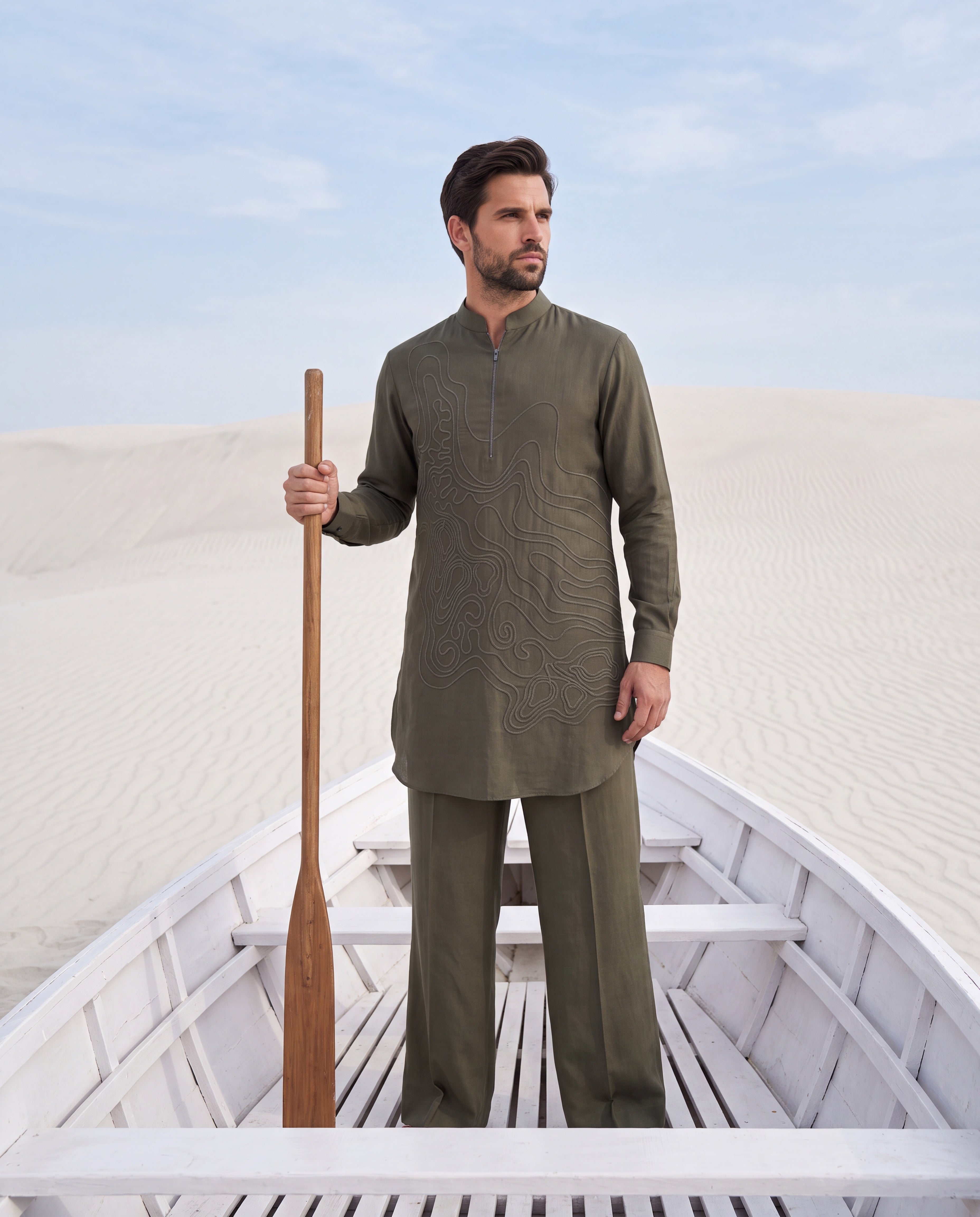 Olive green knit kurta with dori embroidery detailing, paired with matching knit palazzo.