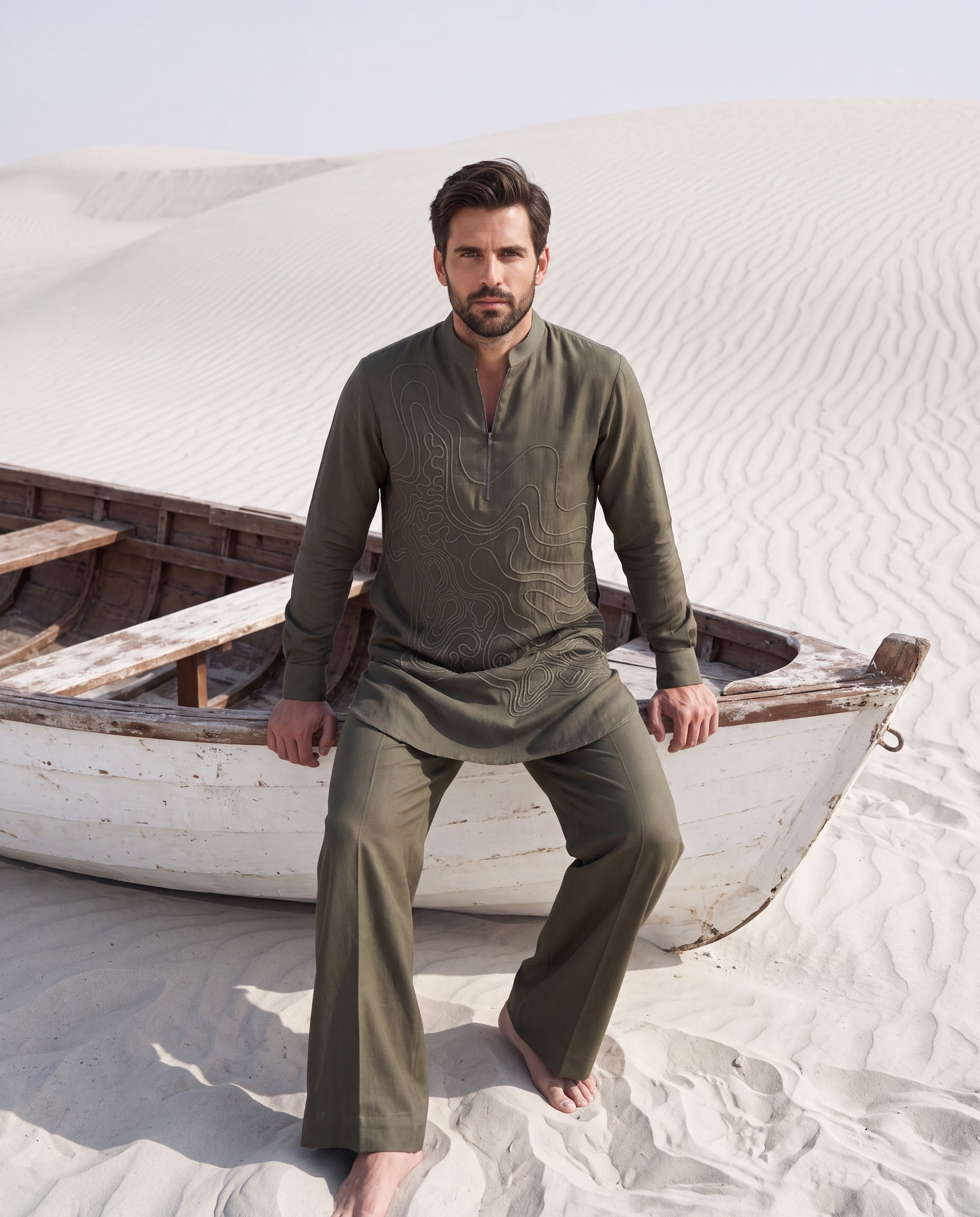 Olive green knit kurta with dori embroidery detailing, paired with matching knit palazzo.