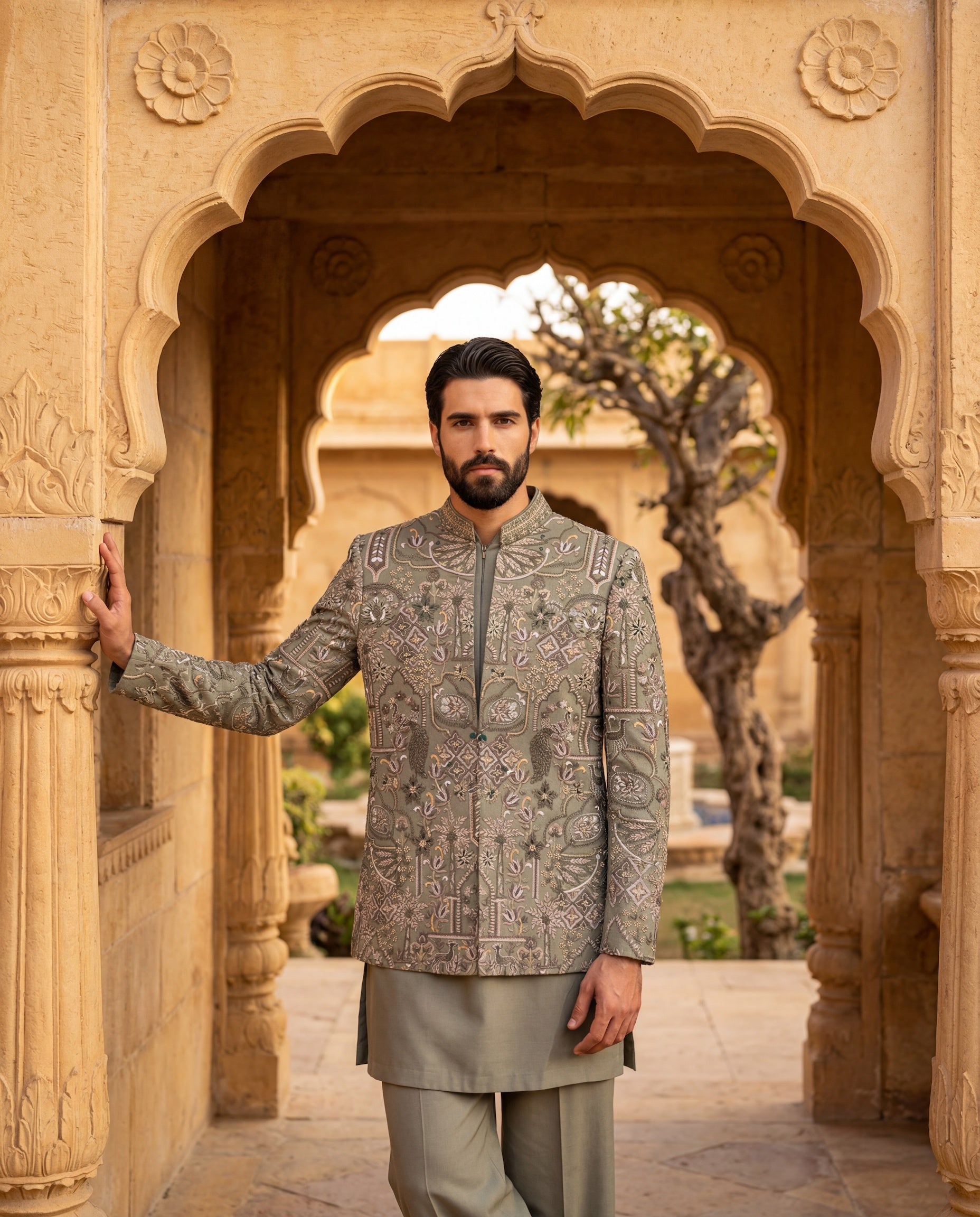 Sage green Twill knit Indo-Western jacket with multi-coloured embroidery detailing, paired with a cotton modal kurta and matching twill knit pants.