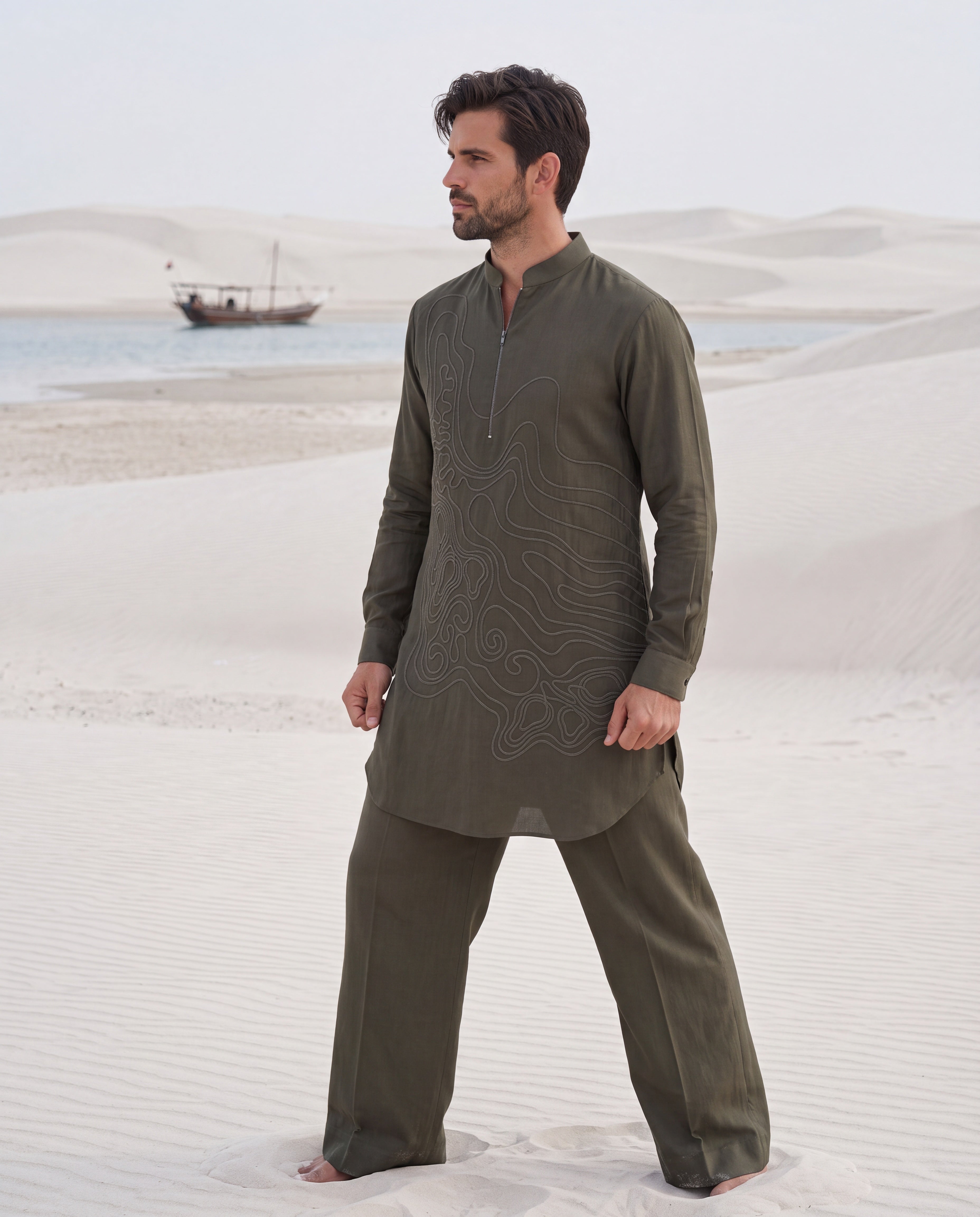 Olive green knit kurta with dori embroidery detailing, paired with matching knit palazzo.