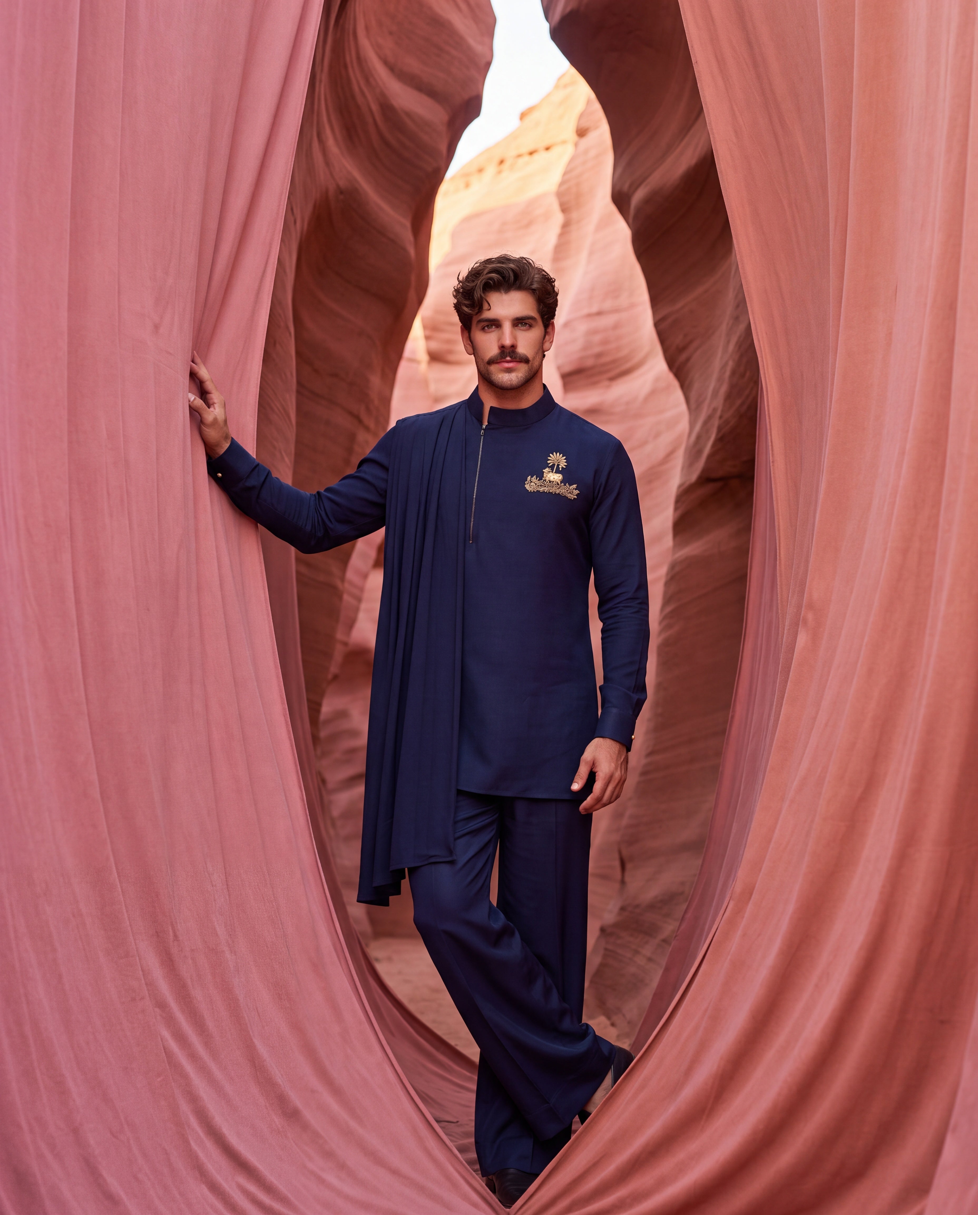 Navy blue knit kurta with gold brooch with embroidery & drape detailing, paired with matching knit palazzo.