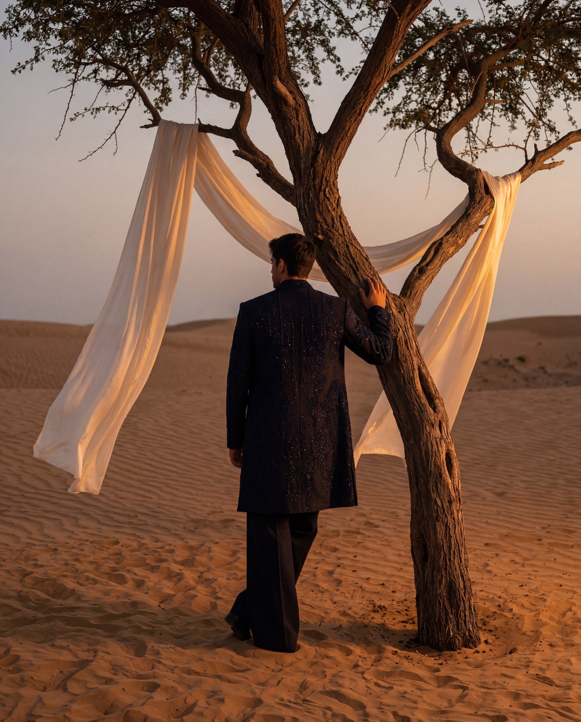 Black Textured knit Indo-Western jacket with tonal embroidery, paired with a crepe kurta and matching palazzo.