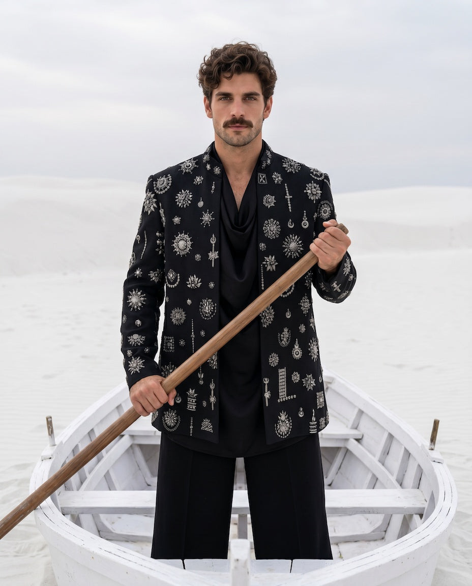Black herringbone knit Indo-Western jacket with metallic motifs embroidery detailing, paired with a cowl kurta and matching palazzo.