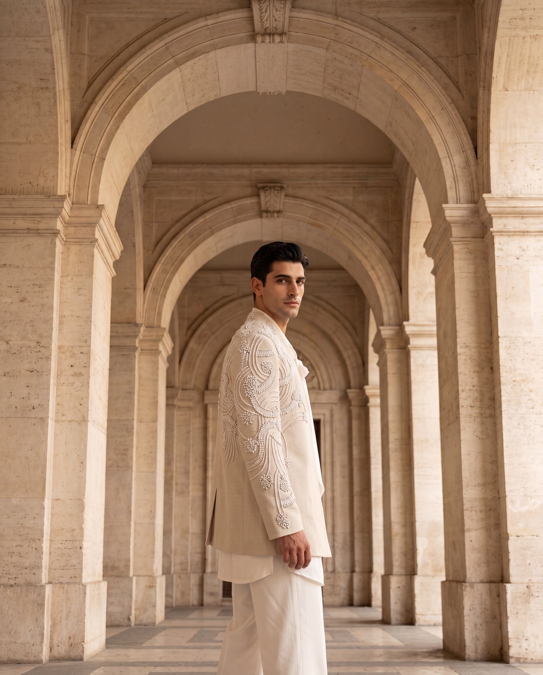 Beige textured rayon Indo-Western jacket with ivory embroidery detailing, paired with a knit kurta and matching palazzo.