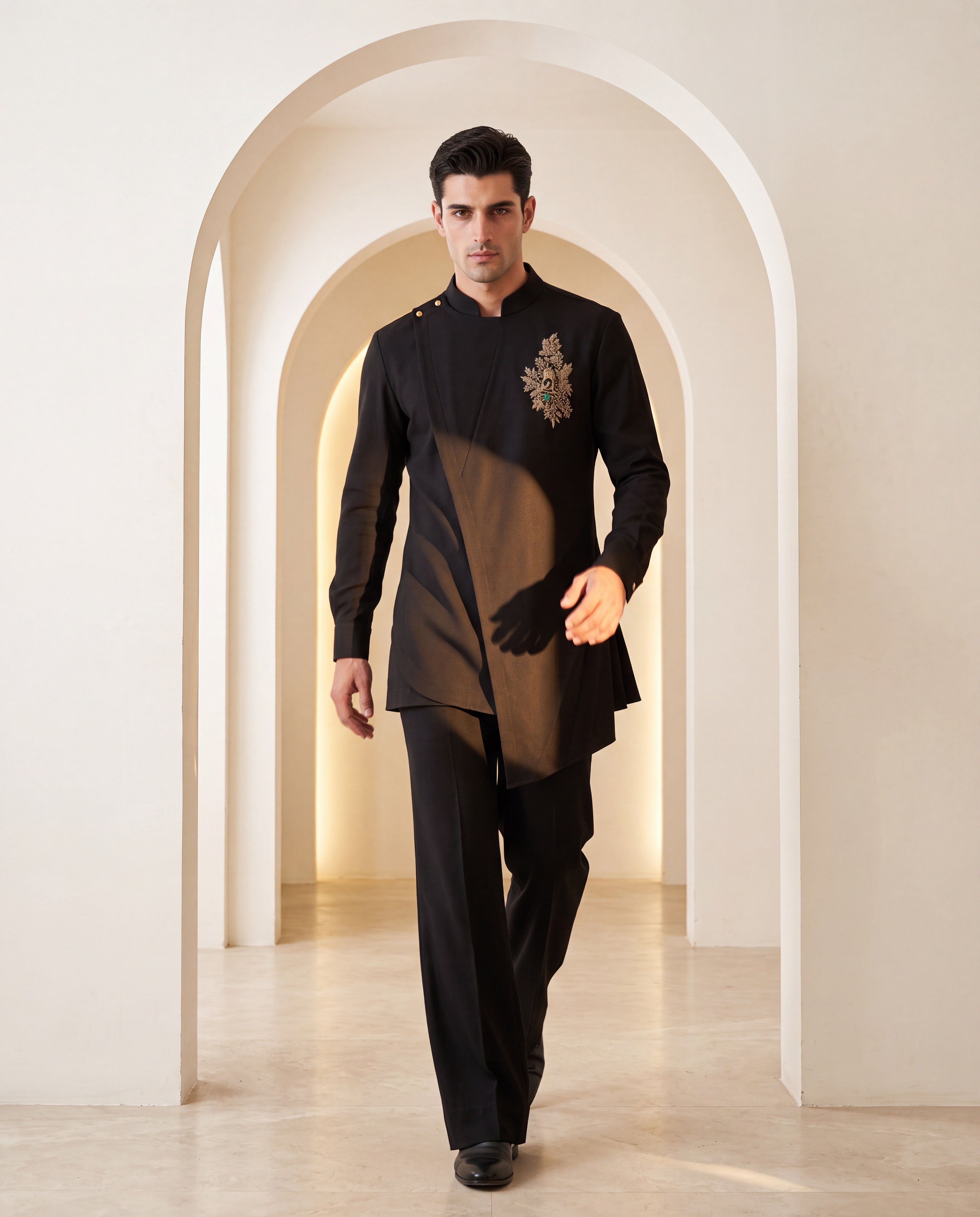 Black knit kurta with gold brooch with embroidery & asymmetric cut detailing, paired with matching knit palazzo.