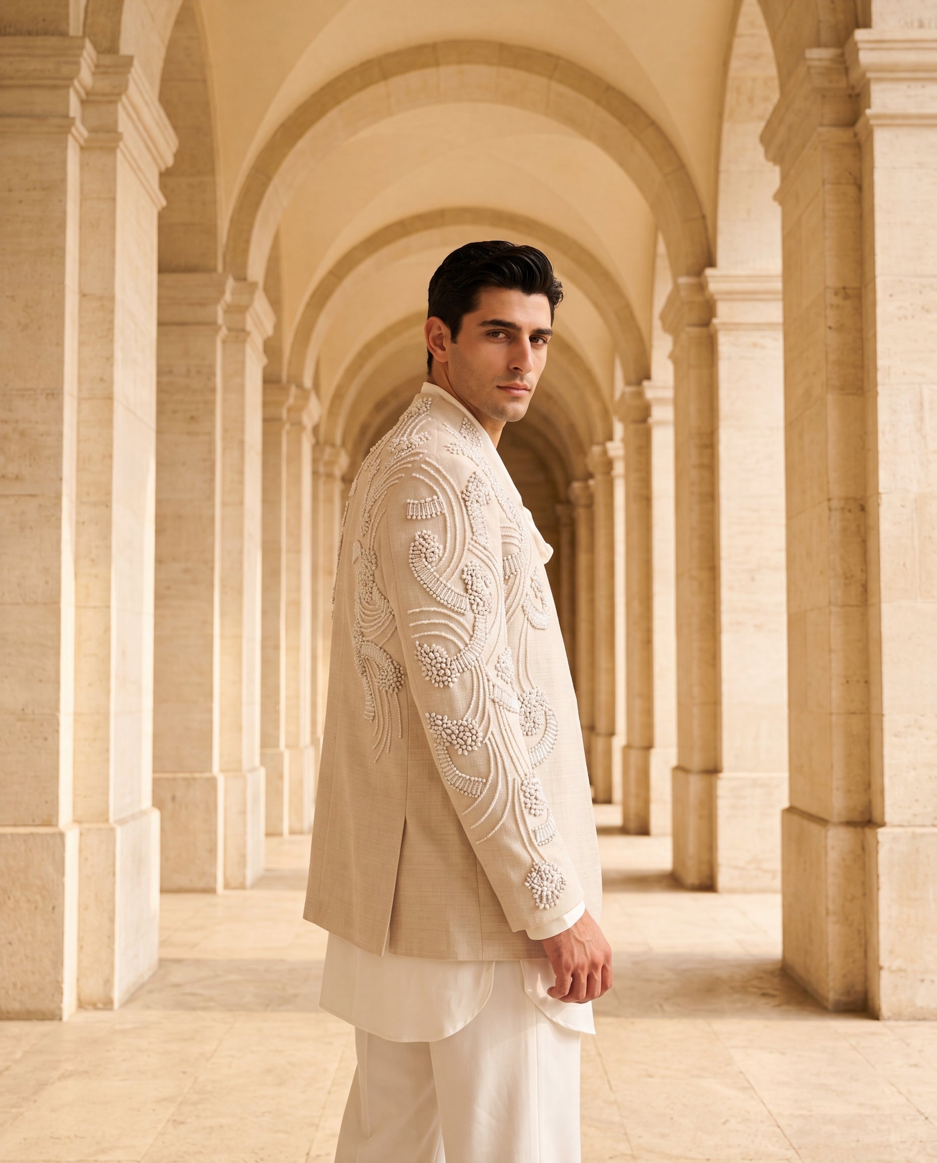Beige textured rayon Indo-Western jacket with ivory embroidery detailing, paired with a knit kurta and matching palazzo.