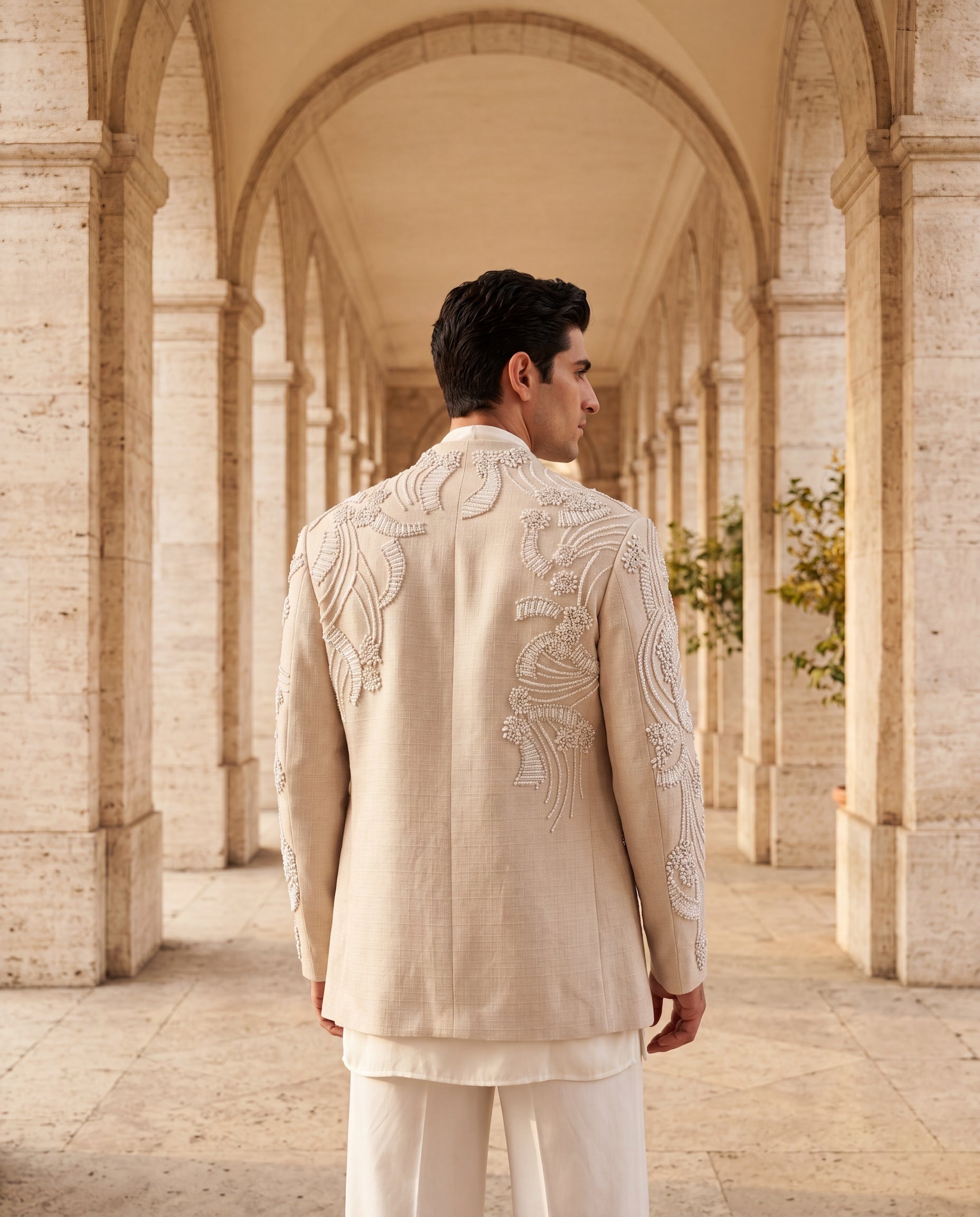 Beige textured rayon Indo-Western jacket with ivory embroidery detailing, paired with a knit kurta and matching palazzo.
