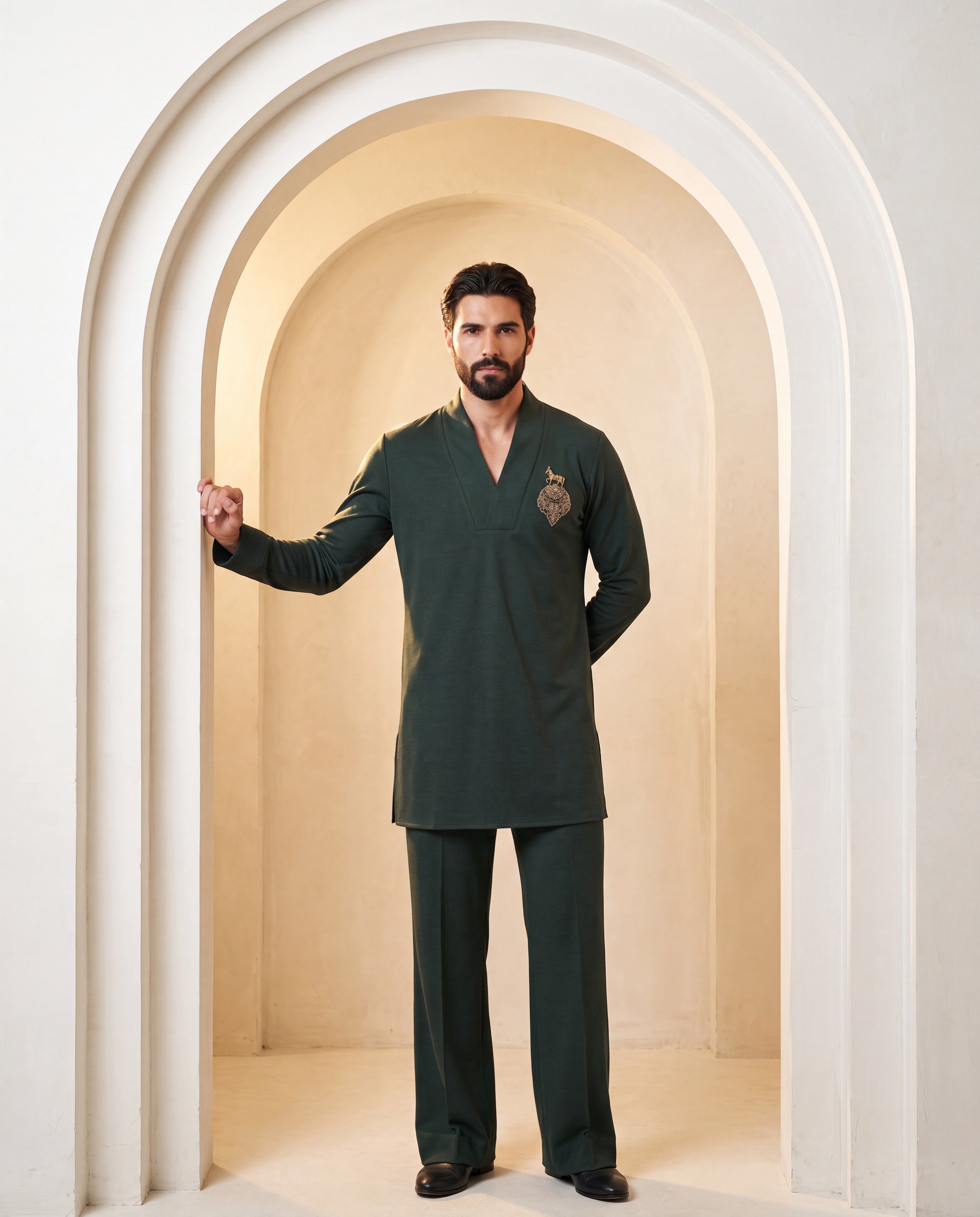 Dark olive green knit kurta with gold brooch with embroidery detailing, paired with matching knit palazzo.