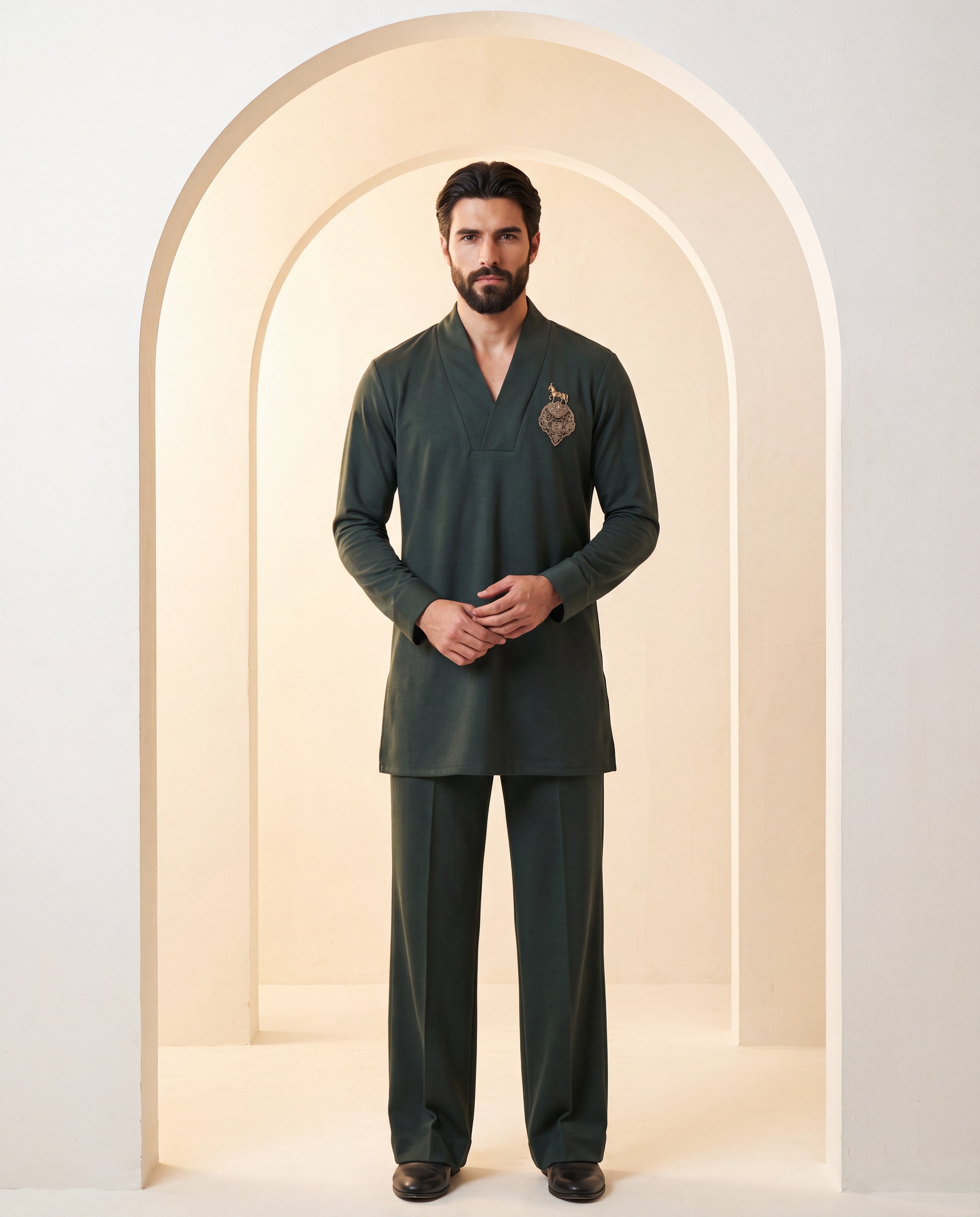 Dark olive green knit kurta with gold brooch with embroidery detailing, paired with matching knit palazzo.