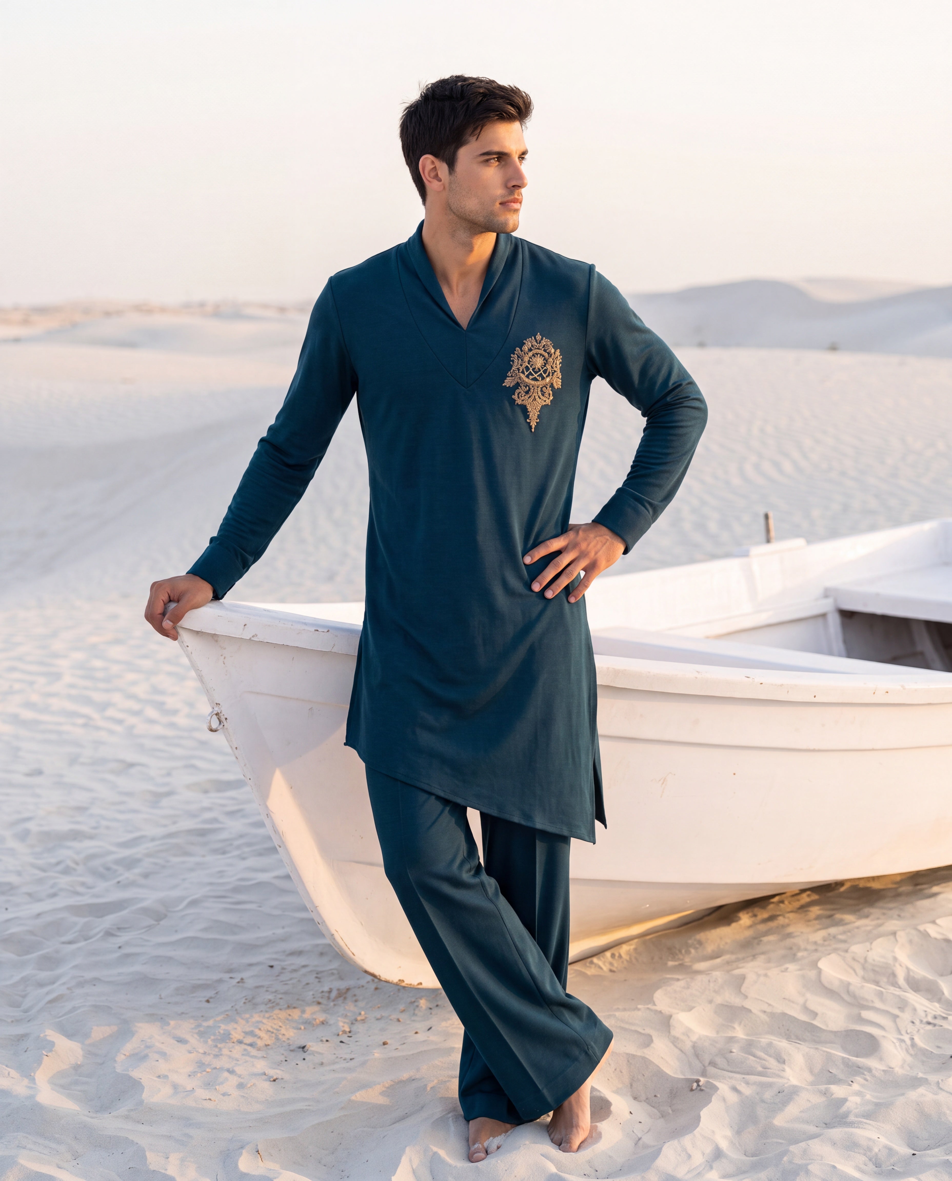 Turquoise knit kurta with gold embroidery detailing, paired with matching knit palazzo.