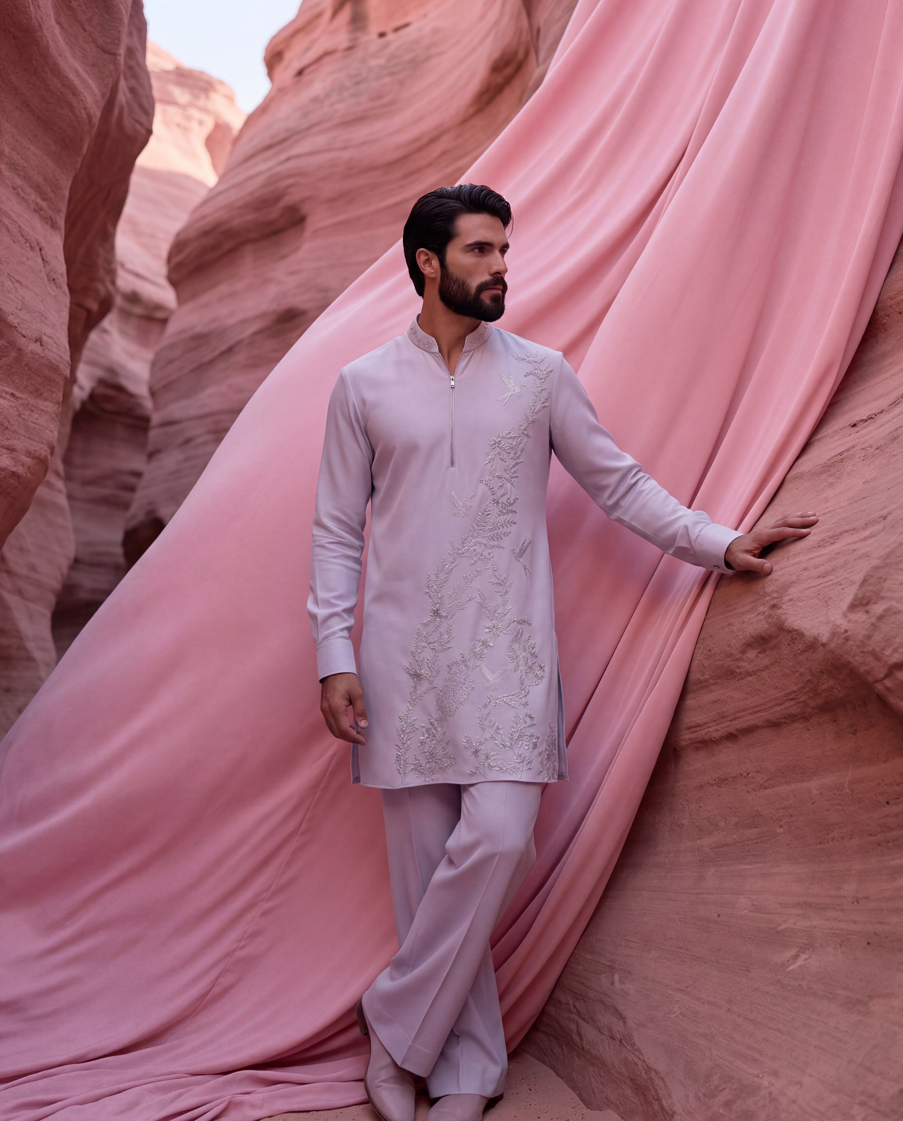 Lilac knit kurta with monntone embroidery detailing, paired with matching knit palazzo.