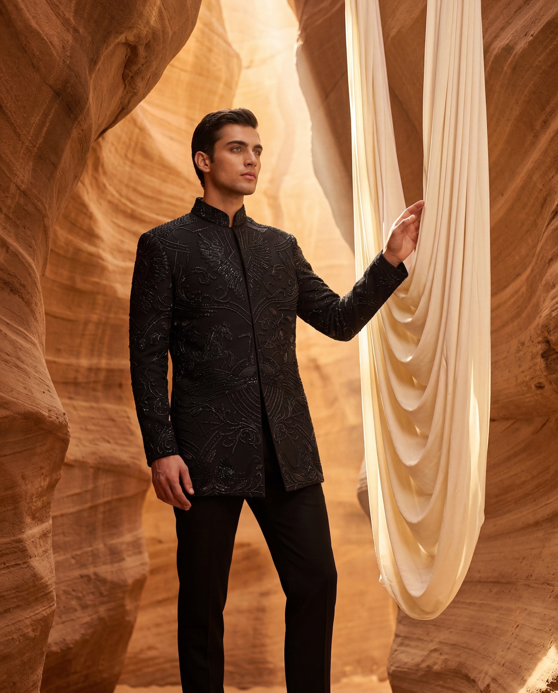 Black textured knit Indo-Western jacket with monotone embroidery, paired with a cotton modal kurta and matching textured knit palazzo.