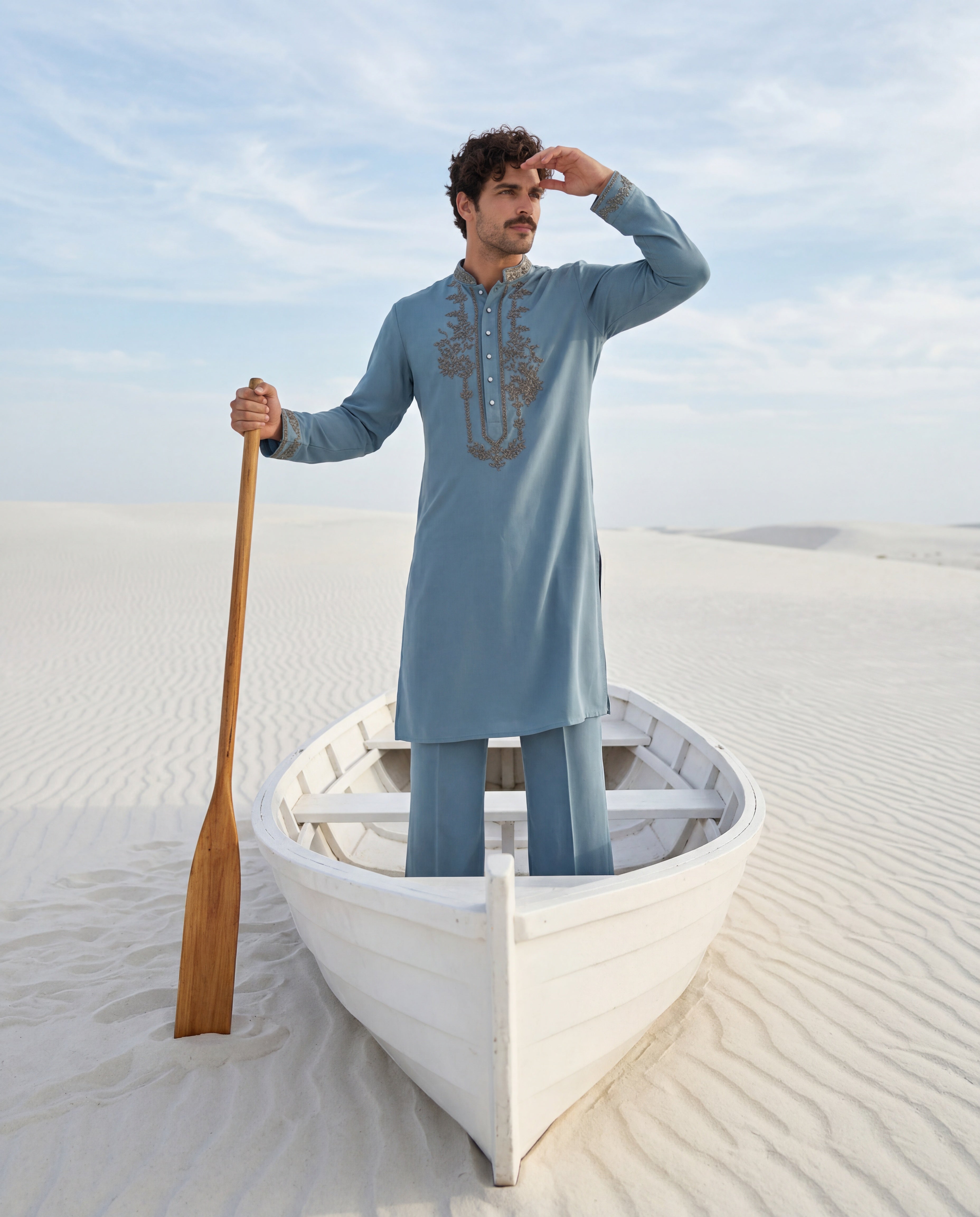 Turquoise knit kurta with embroidered neckline detailing, paired with matching knit palazzo.