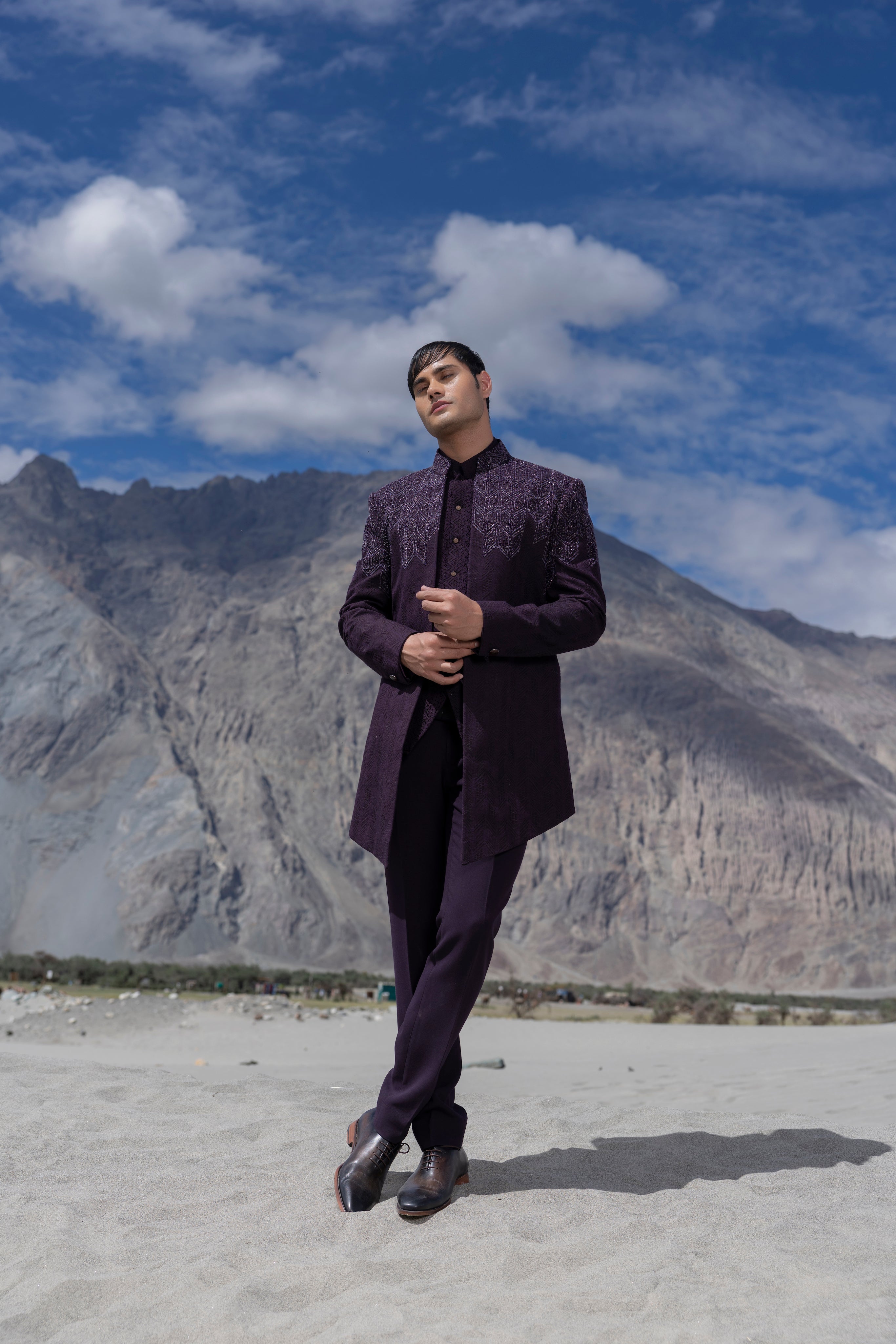 Purple crochet hand-embroidered open indowestern jacket paired with a matching crochet waistcoat and a pant.