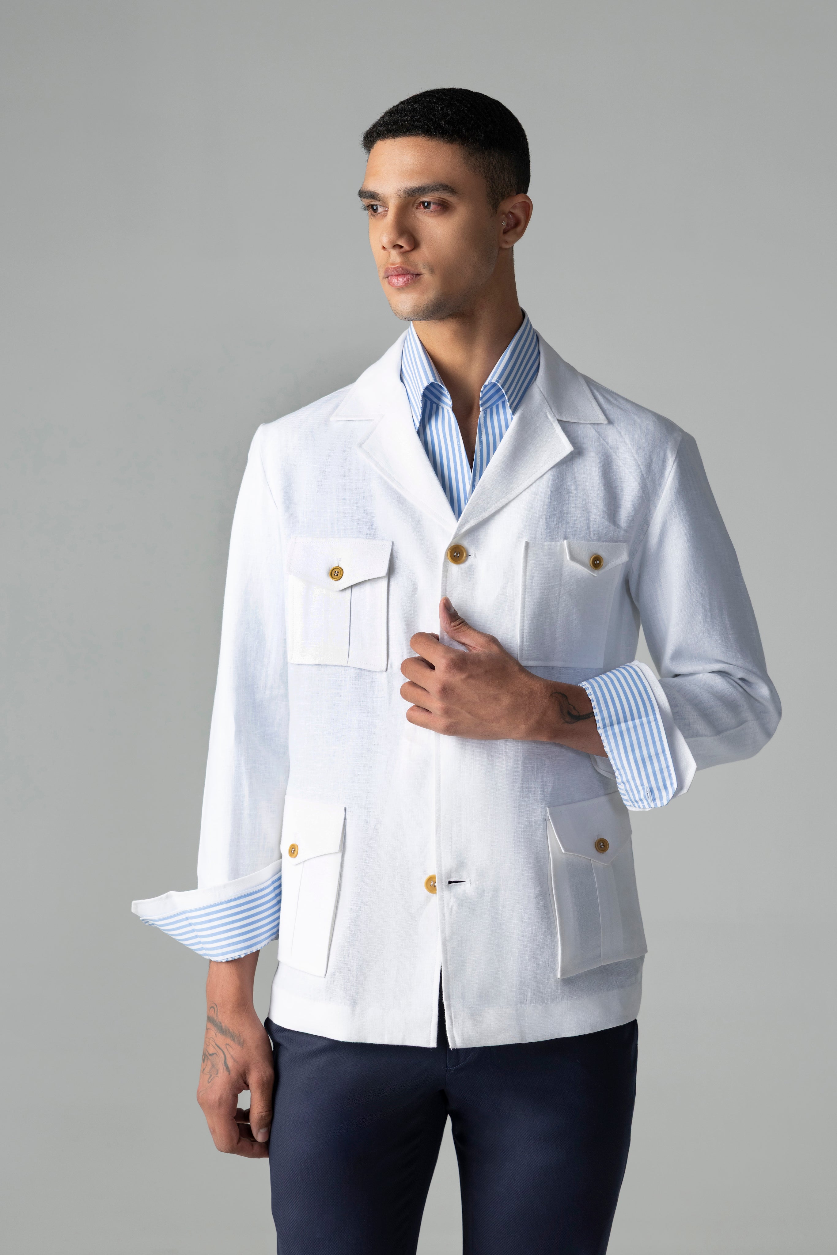 Whiite linen shacket with four patch pockets, button down collar and contrast button detailing