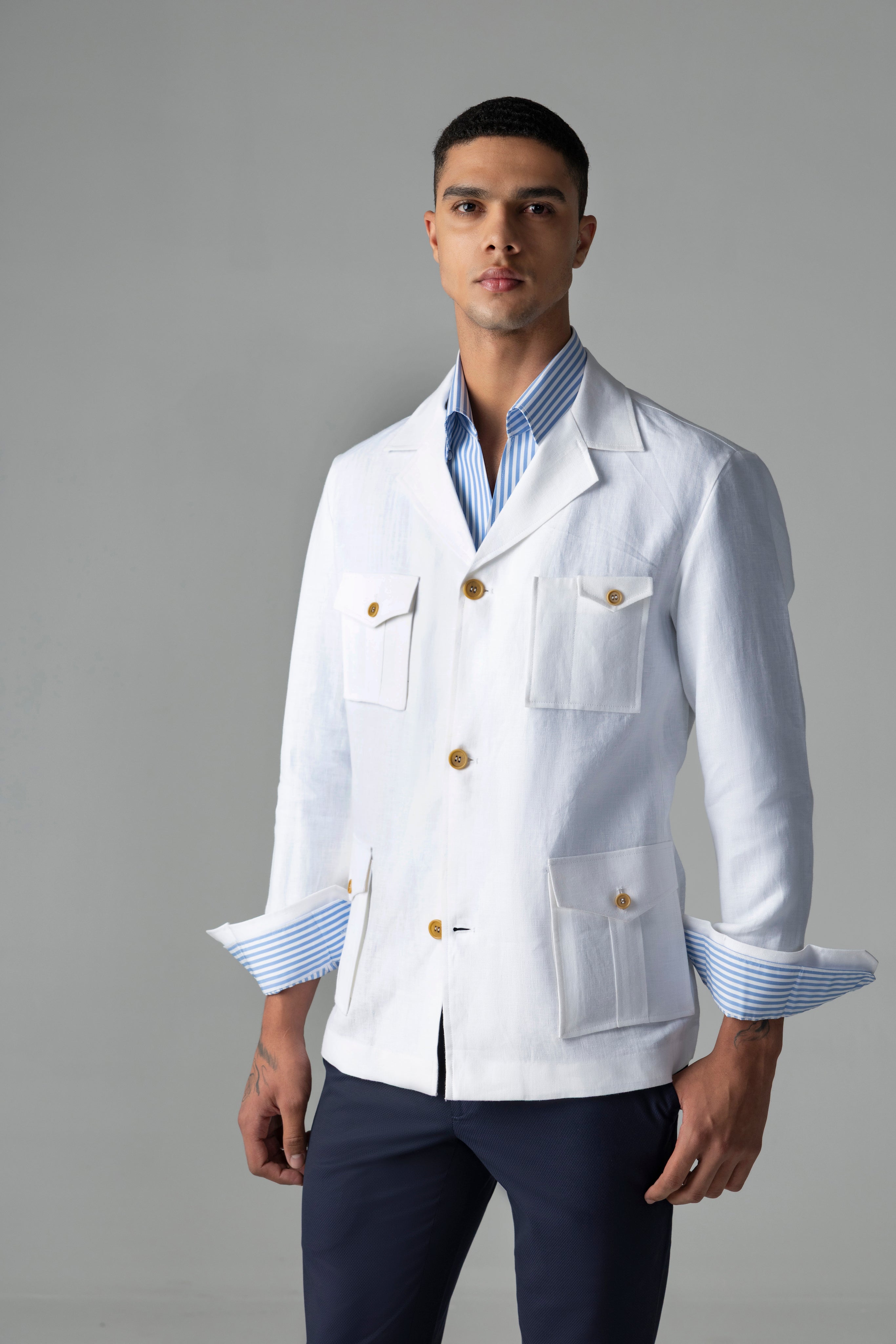 Whiite linen shacket with four patch pockets, button down collar and contrast button detailing