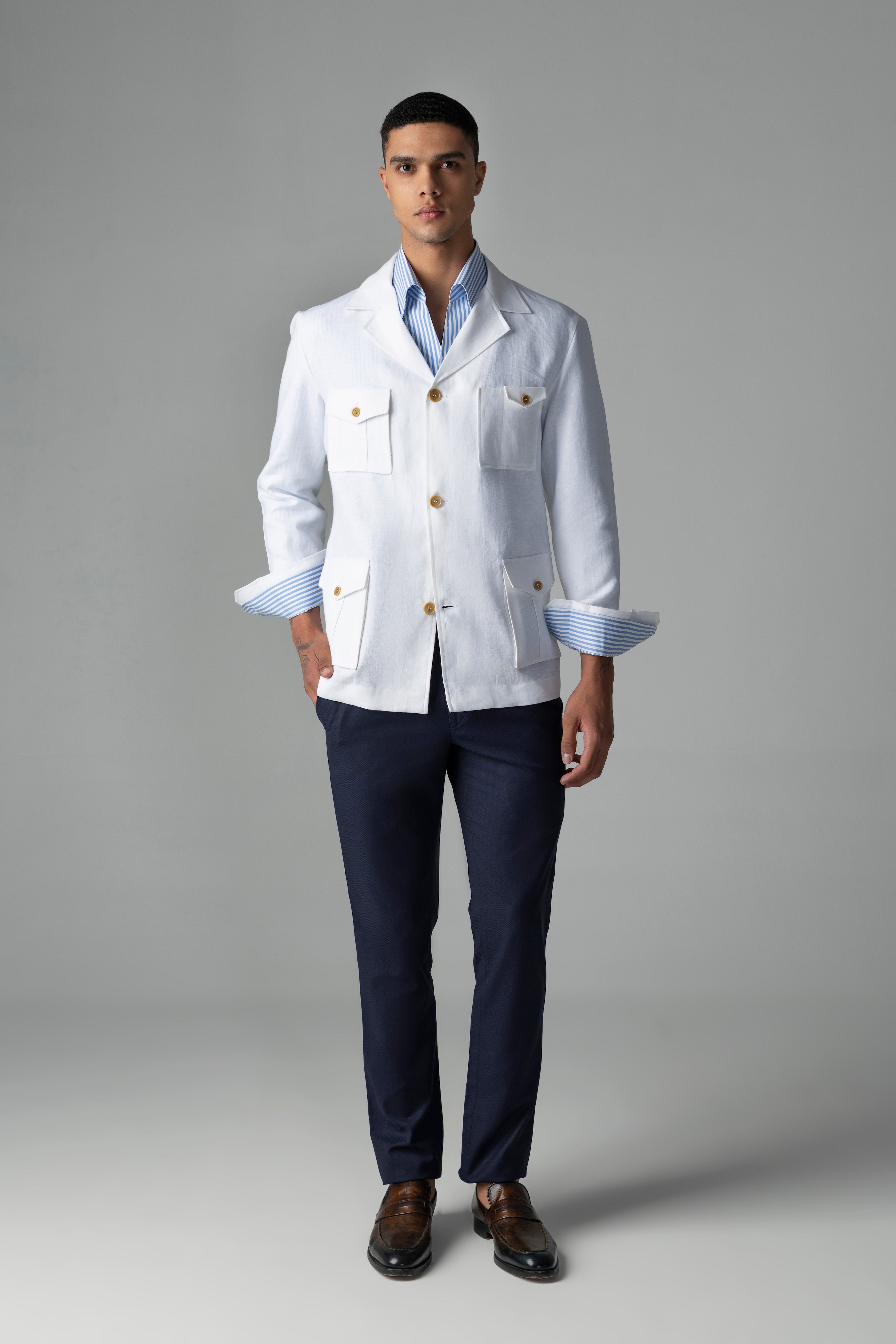 Whiite linen shacket with four patch pockets, button down collar and contrast button detailing