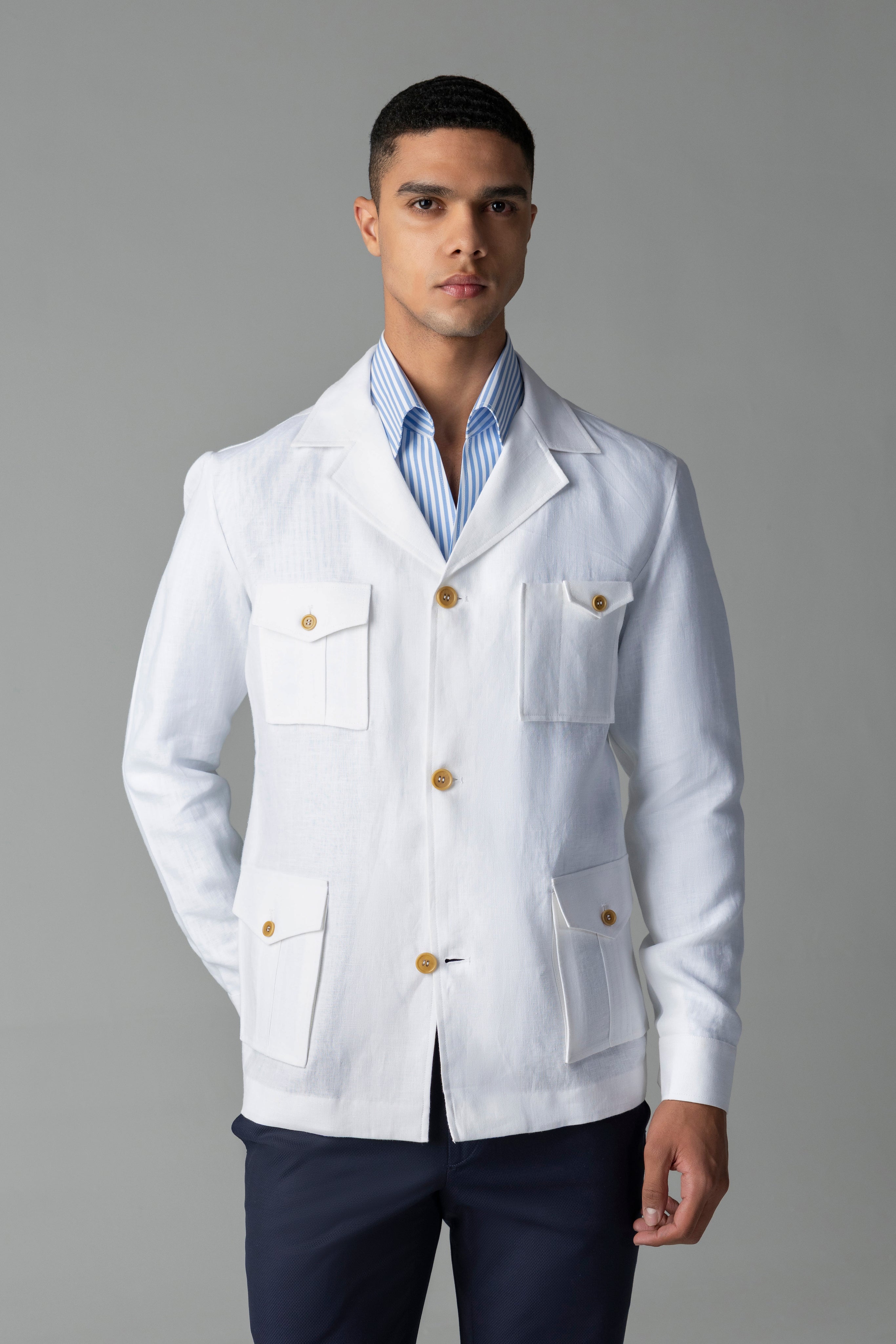 Whiite linen shacket with four patch pockets, button down collar and contrast button detailing