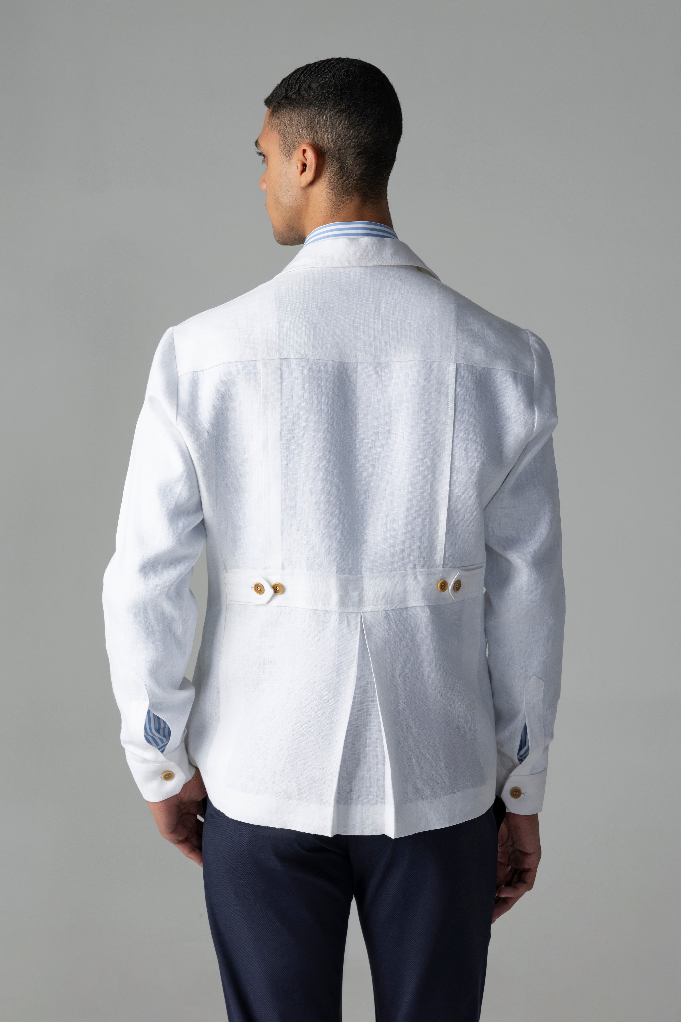Whiite linen shacket with four patch pockets, button down collar and contrast button detailing