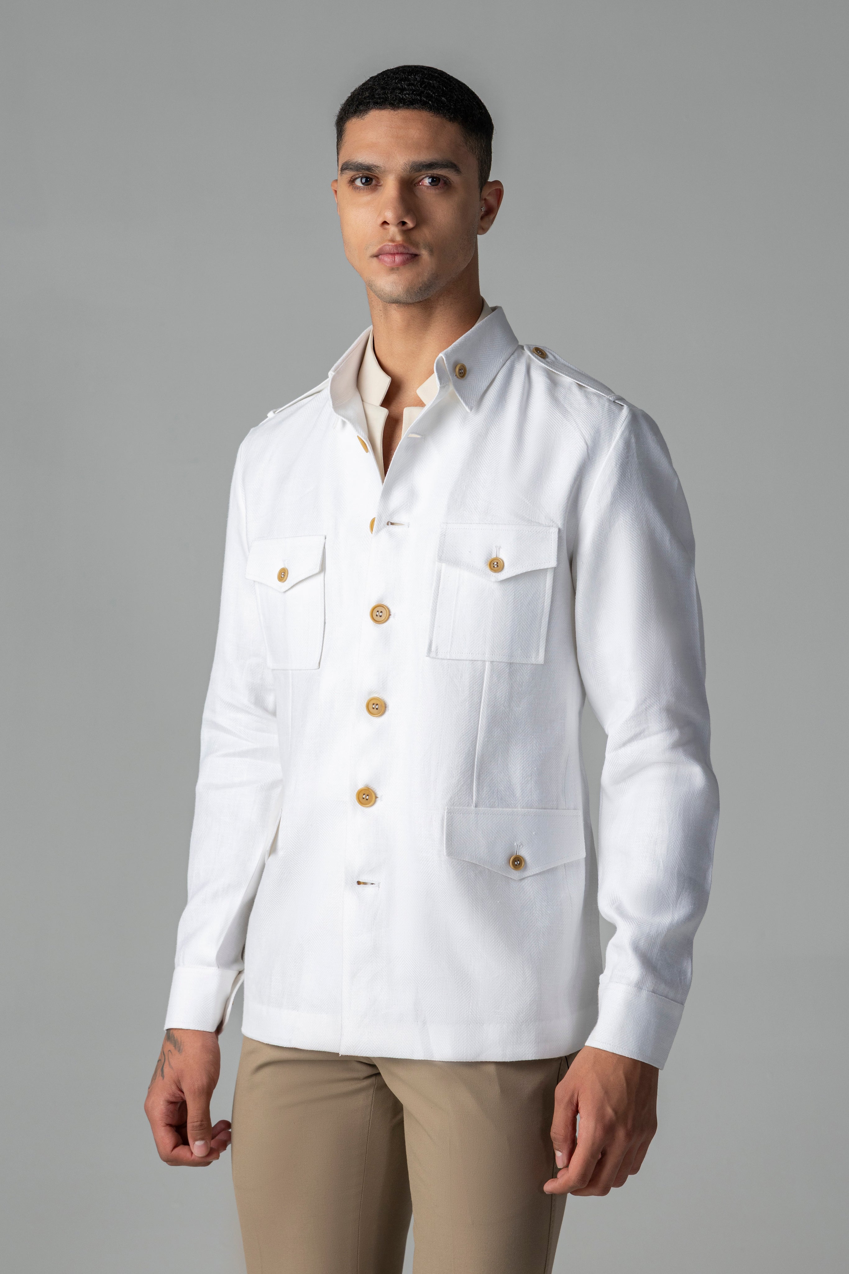 Whiite linen shacket with four patch pockets, button down collar and contrast button detailing