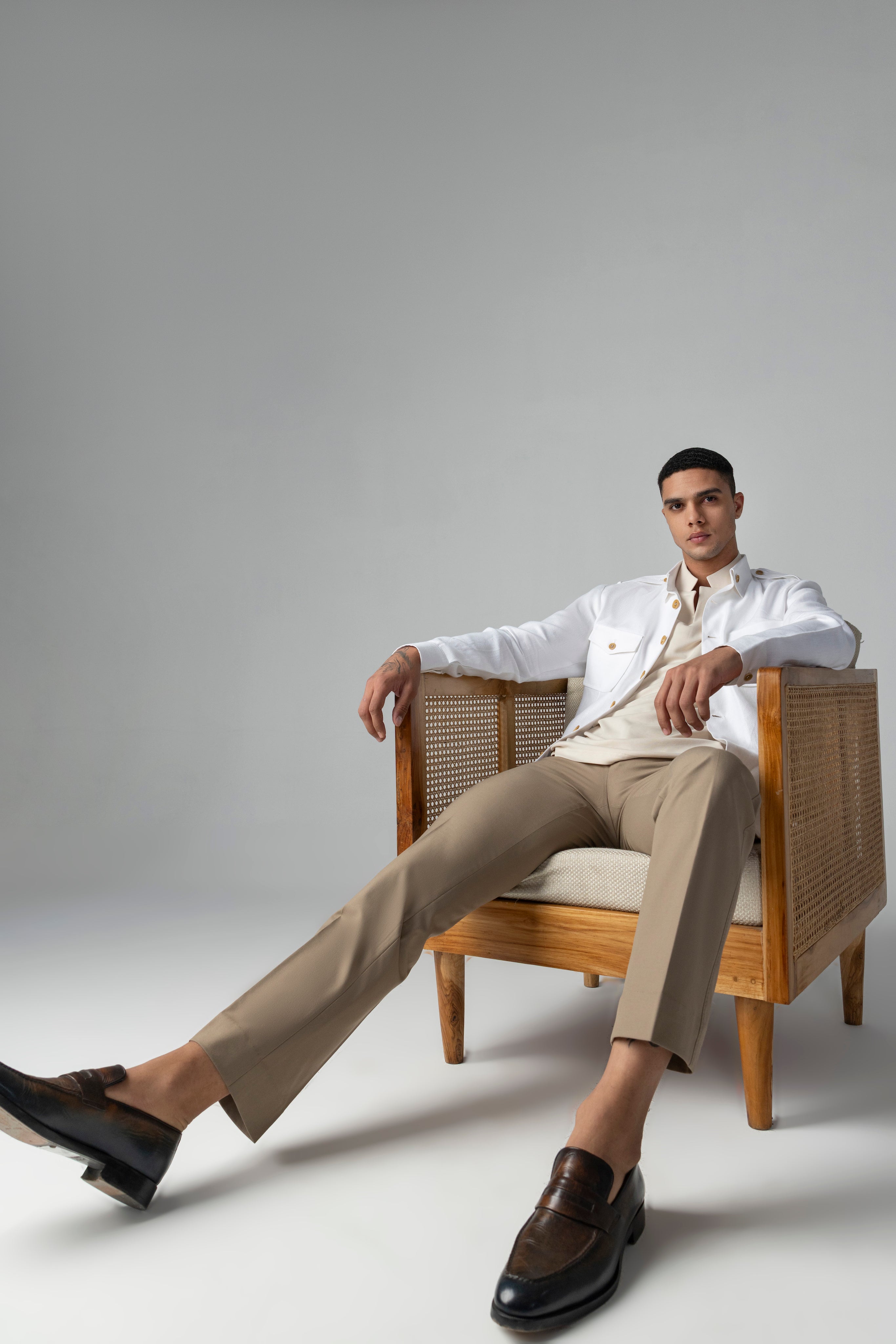 Whiite linen shacket with four patch pockets, button down collar and contrast button detailing