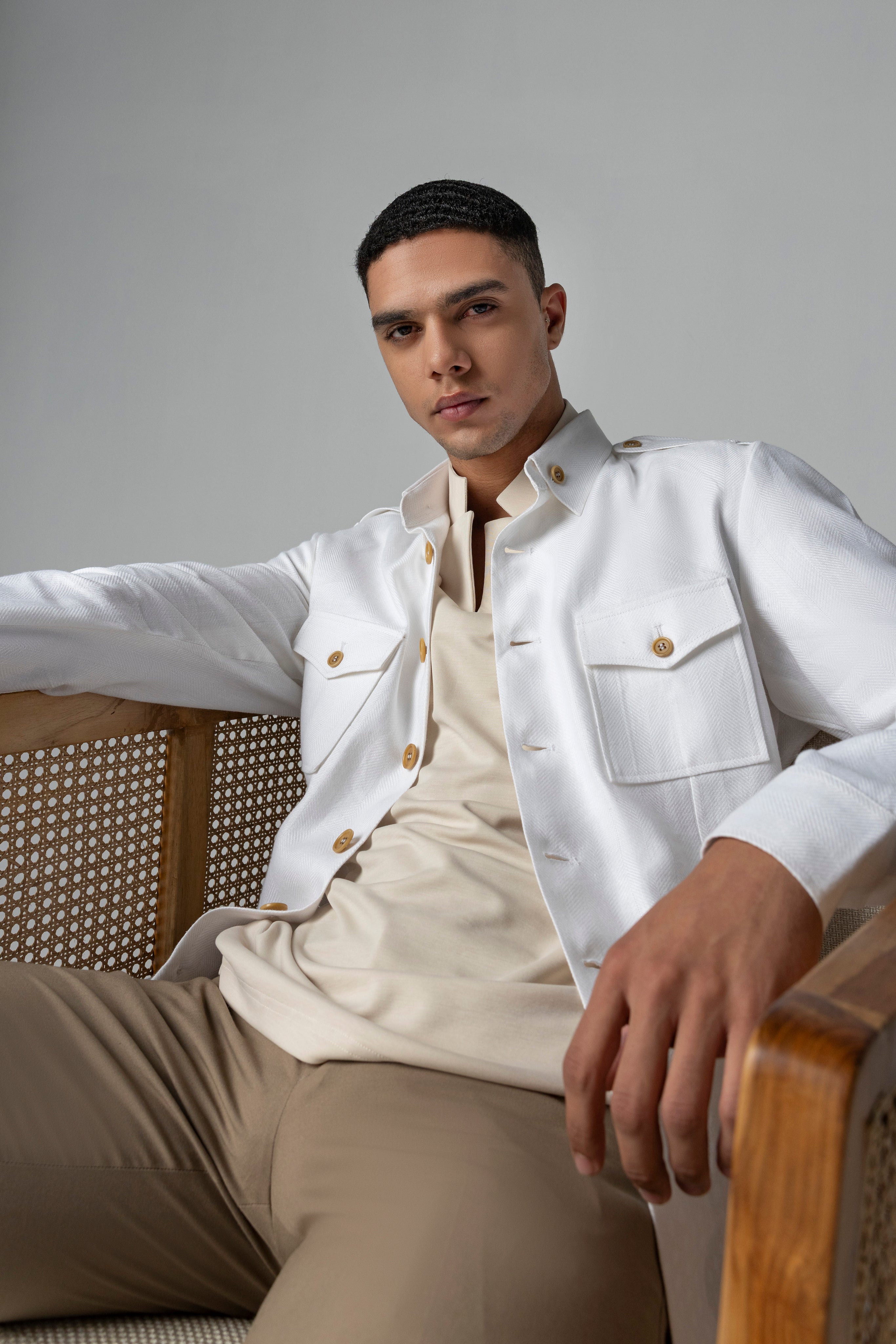 Whiite linen shacket with four patch pockets, button down collar and contrast button detailing