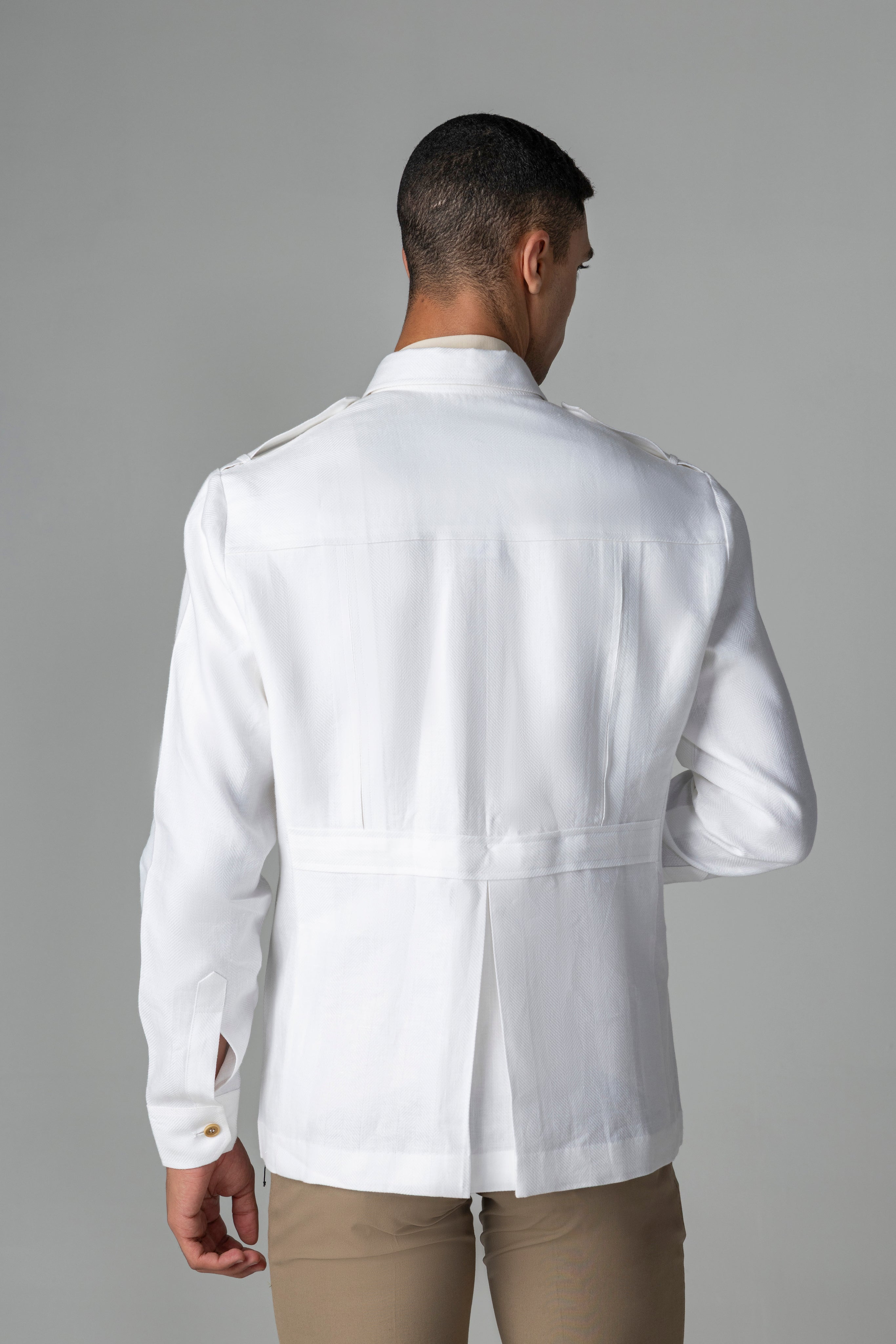 Whiite linen shacket with four patch pockets, button down collar and contrast button detailing
