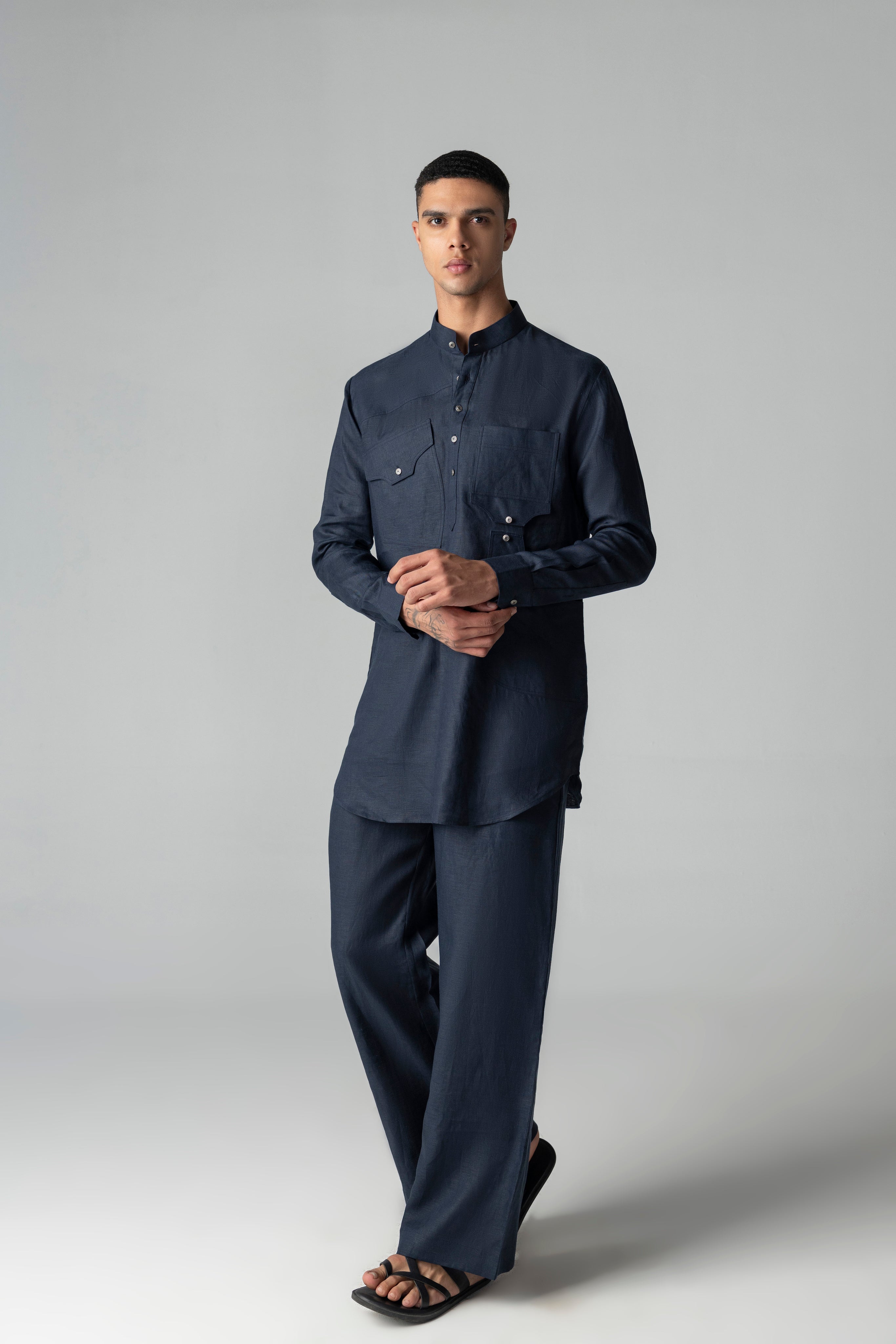 Navy blue linen short kurta with patch pocket detailing, paired with a matching plazzo