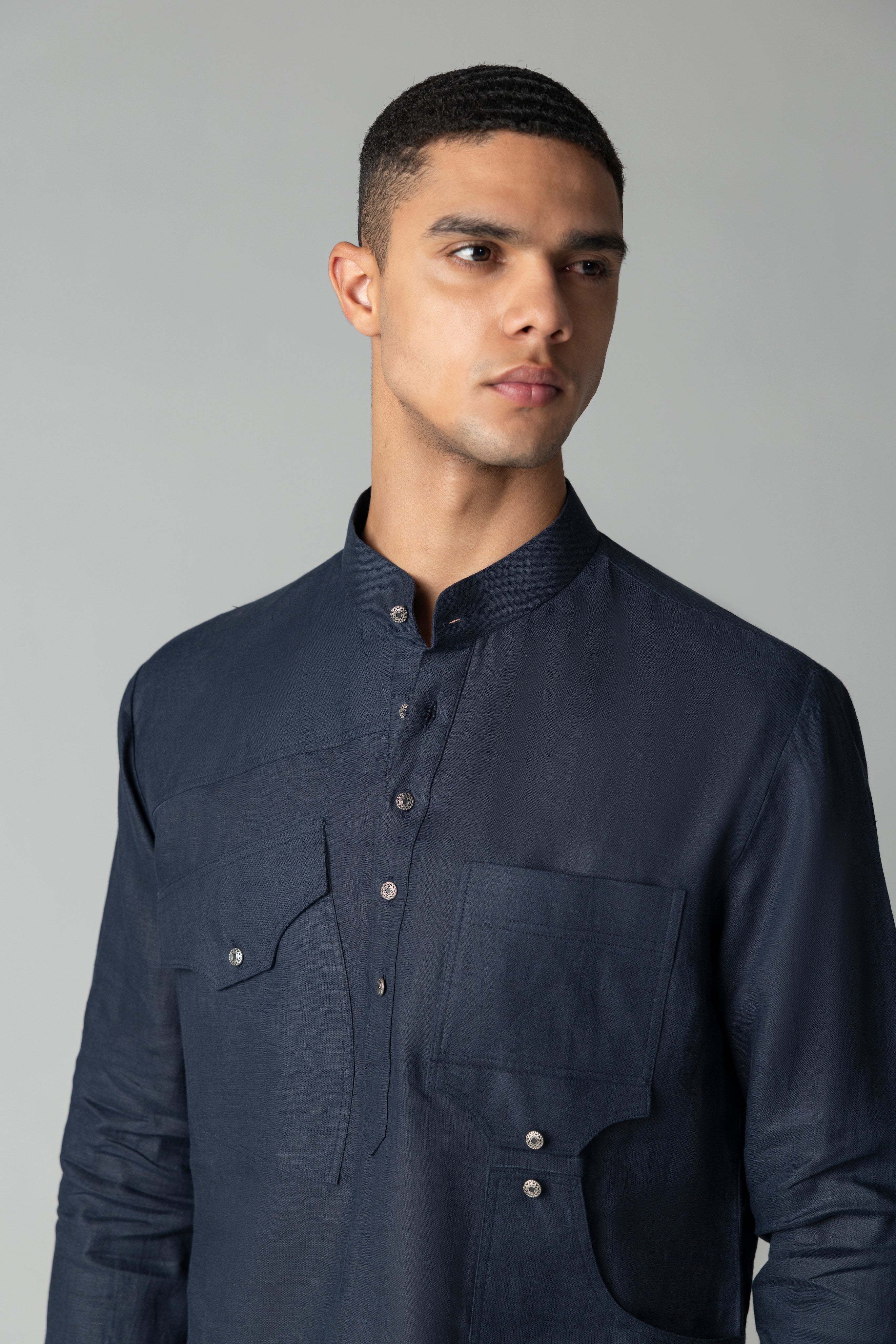Navy blue linen short kurta with patch pocket detailing, paired with a matching plazzo