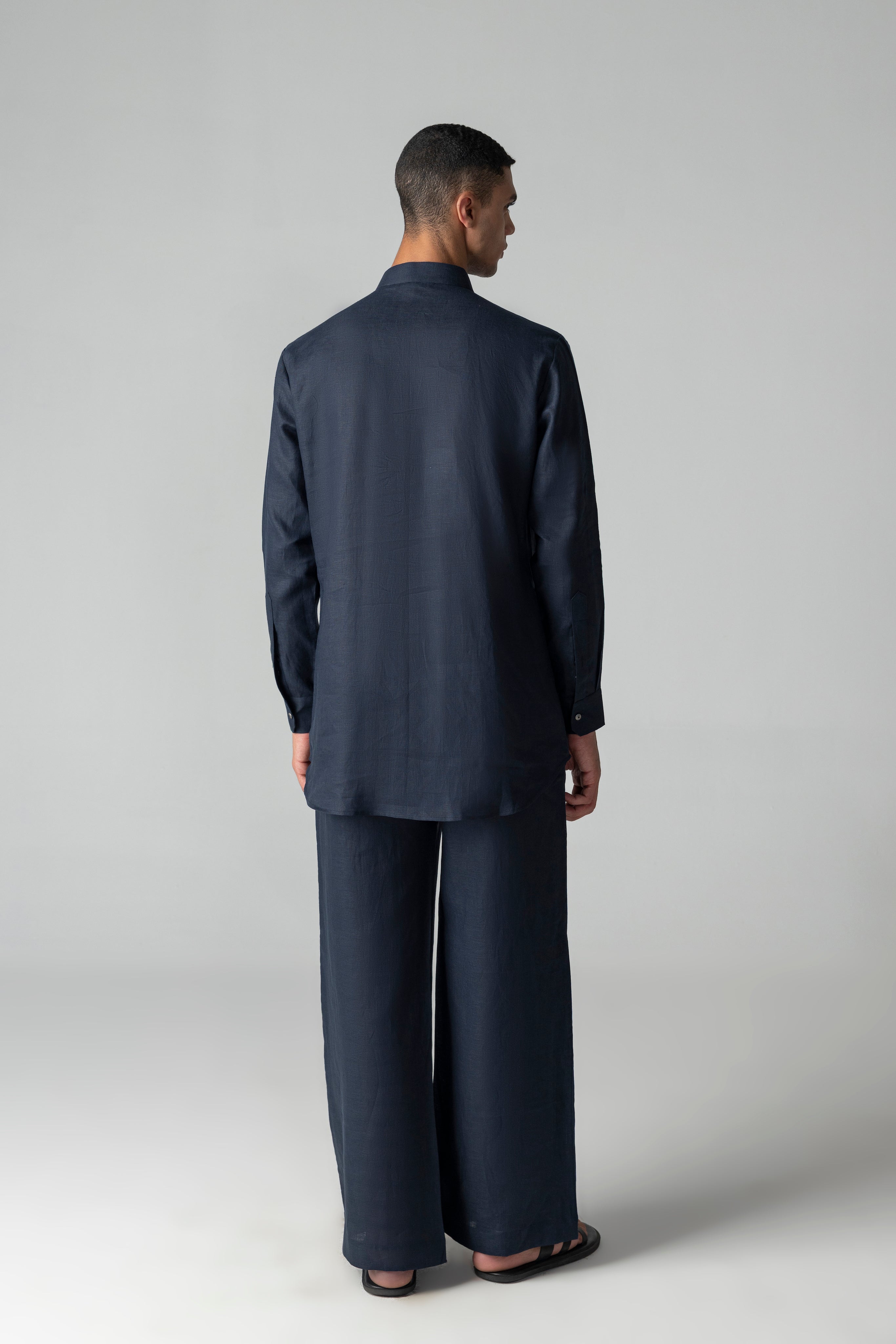 Navy blue linen short kurta with patch pocket detailing, paired with a matching plazzo