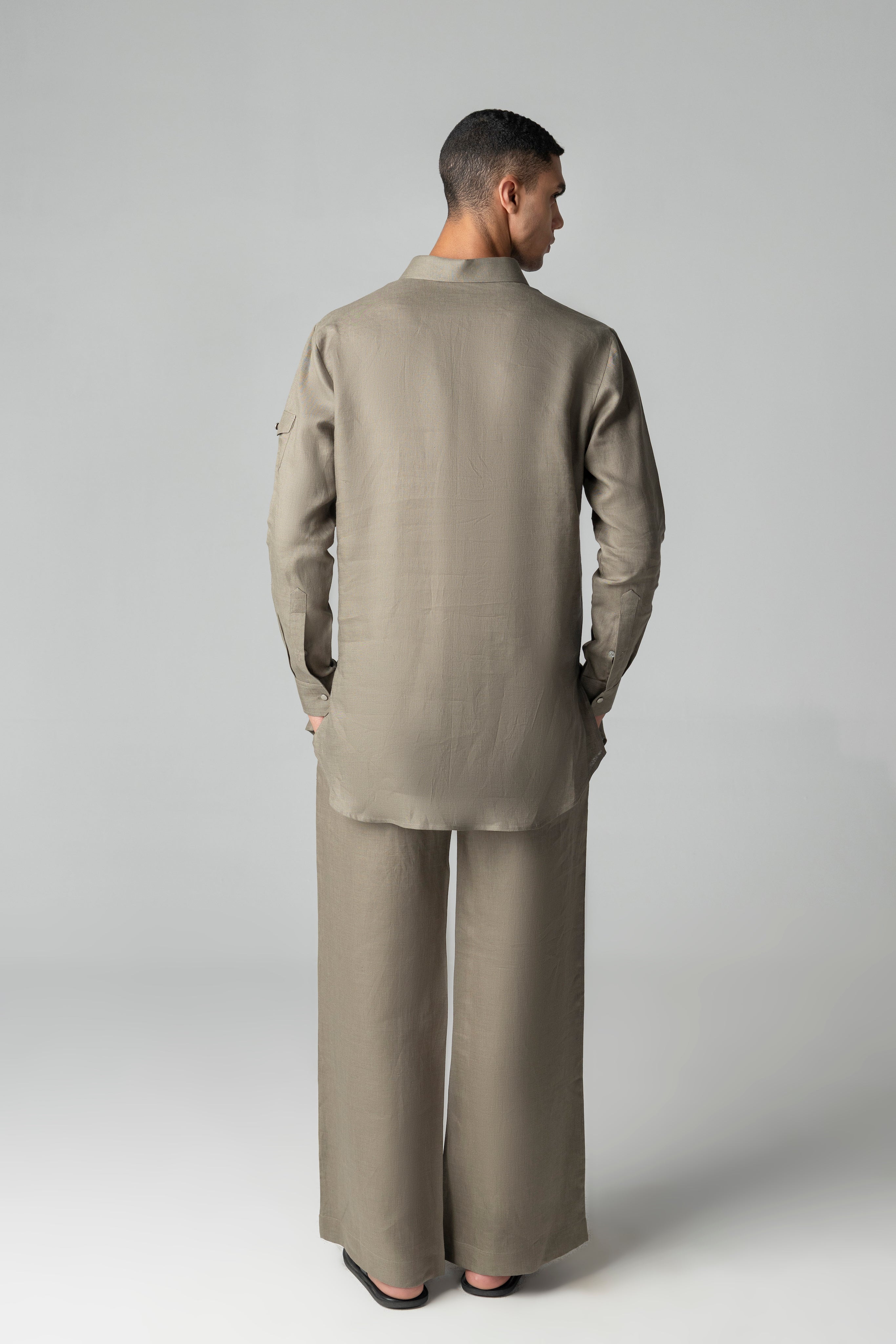 Olive green short linen kurta with button detailing, paired with a matching plazzo.